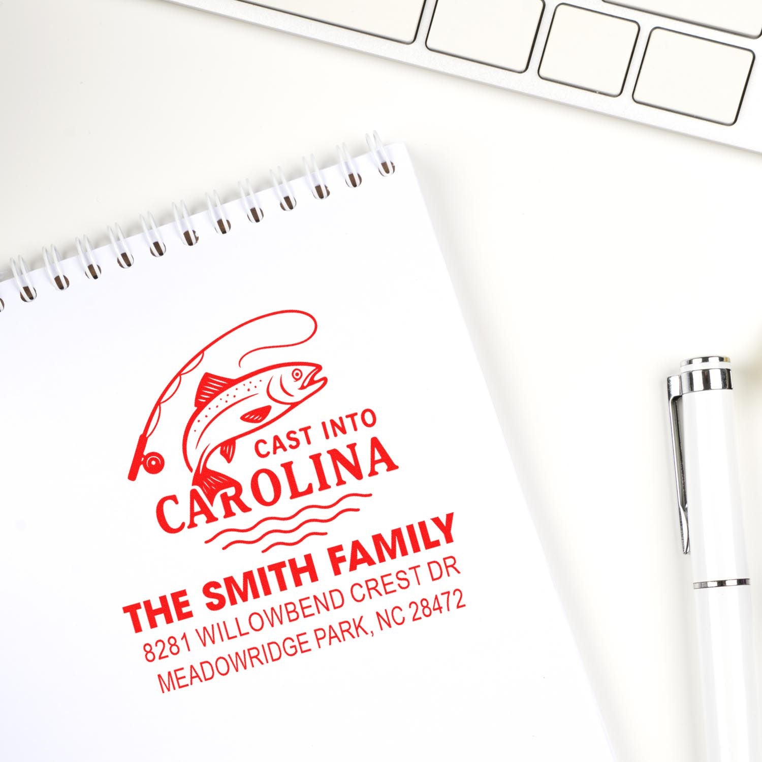 Custom fishing-themed rubber stamp with family name and address, ideal for personalized branding and mail labeling.