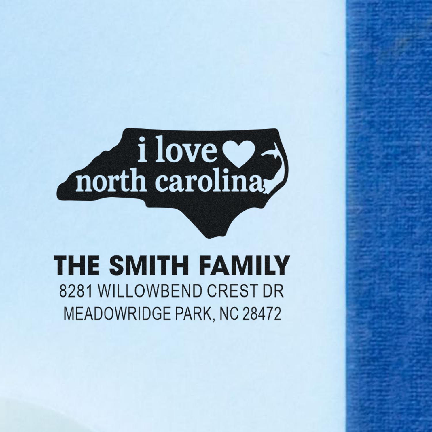 Custom North Carolina address rubber stamp with I love North Carolina state silhouette and Smith Family return address.