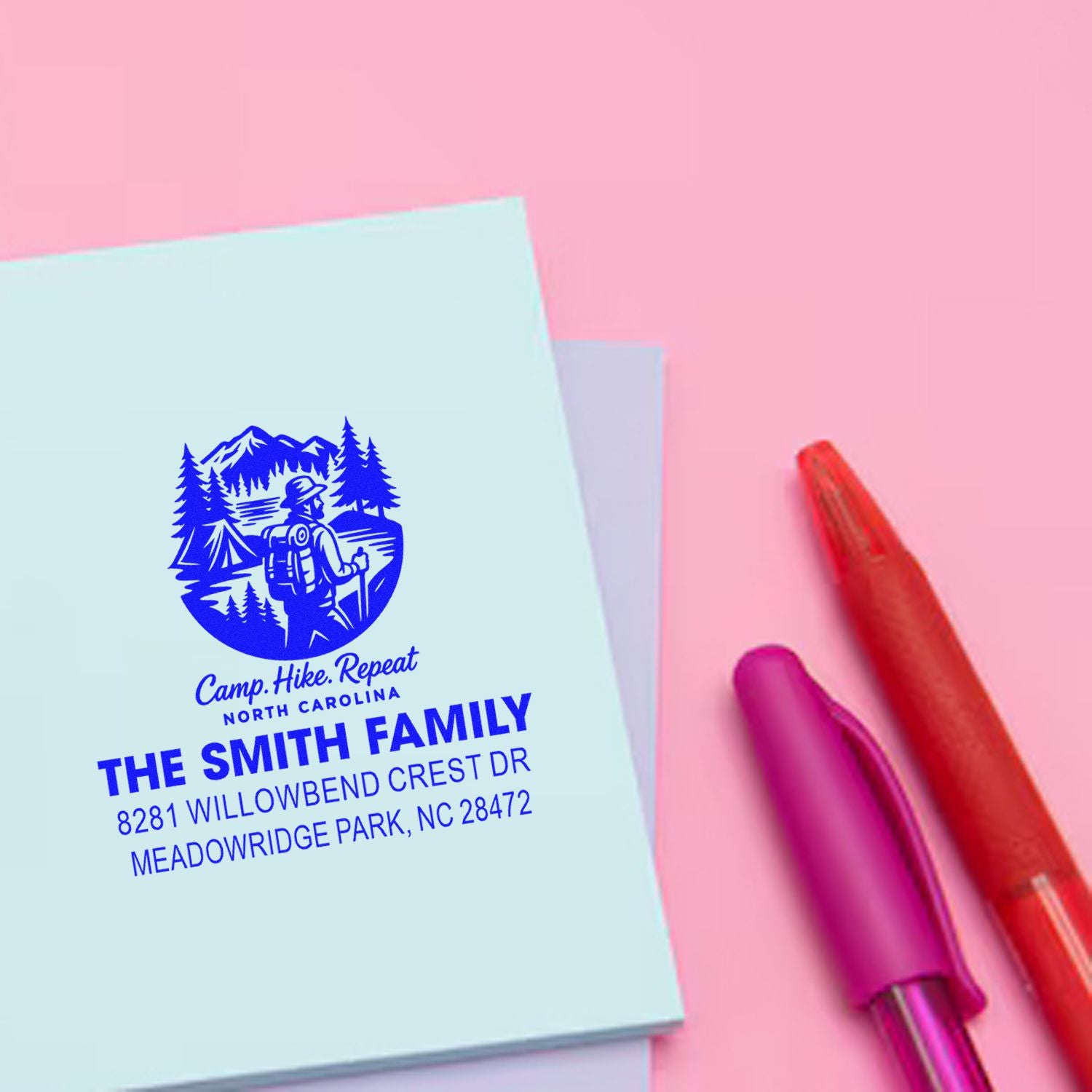 Custom rubber stamp with camping family logo and return address, ideal for personalized stationery and business mail.