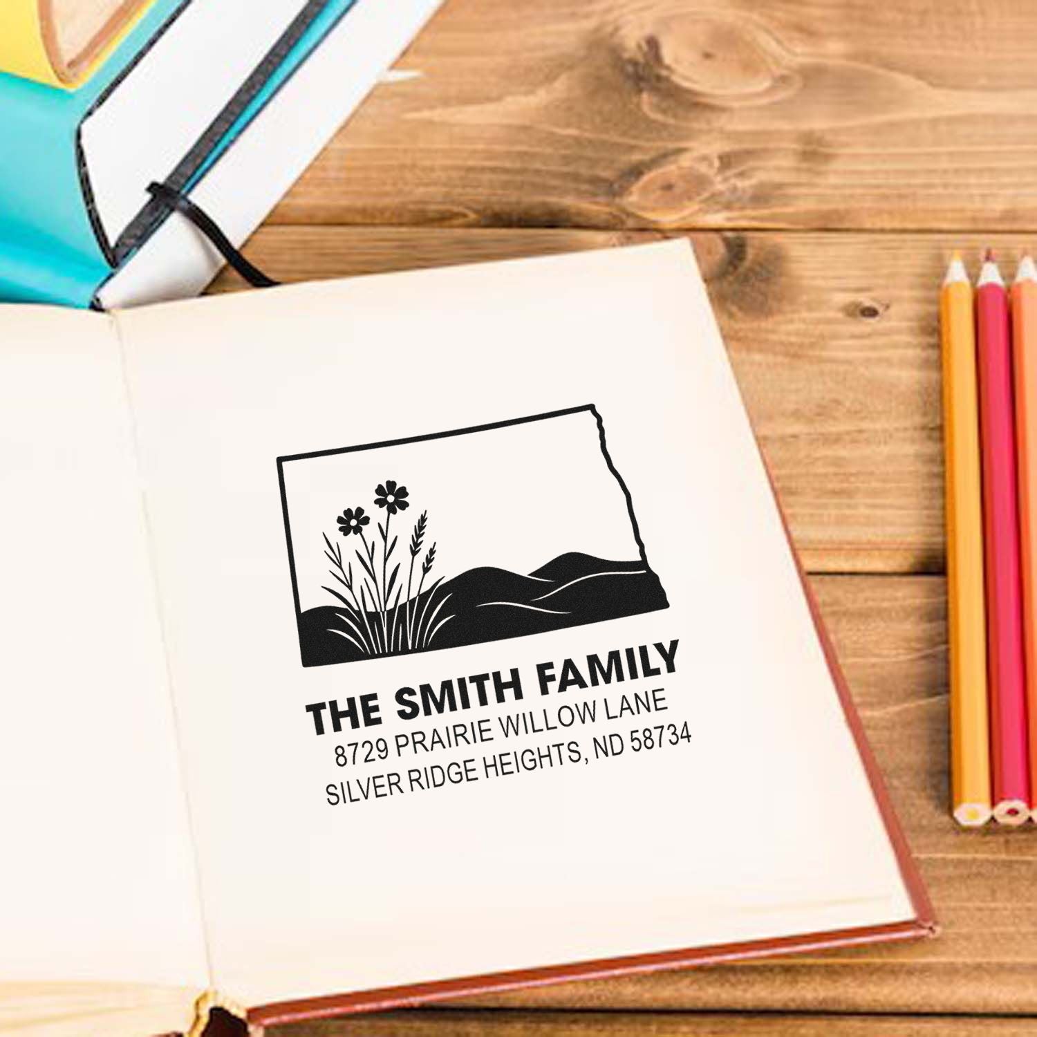 Custom family return address rubber stamp with floral prairie design for envelopes, notebooks, and personalized stationery.
