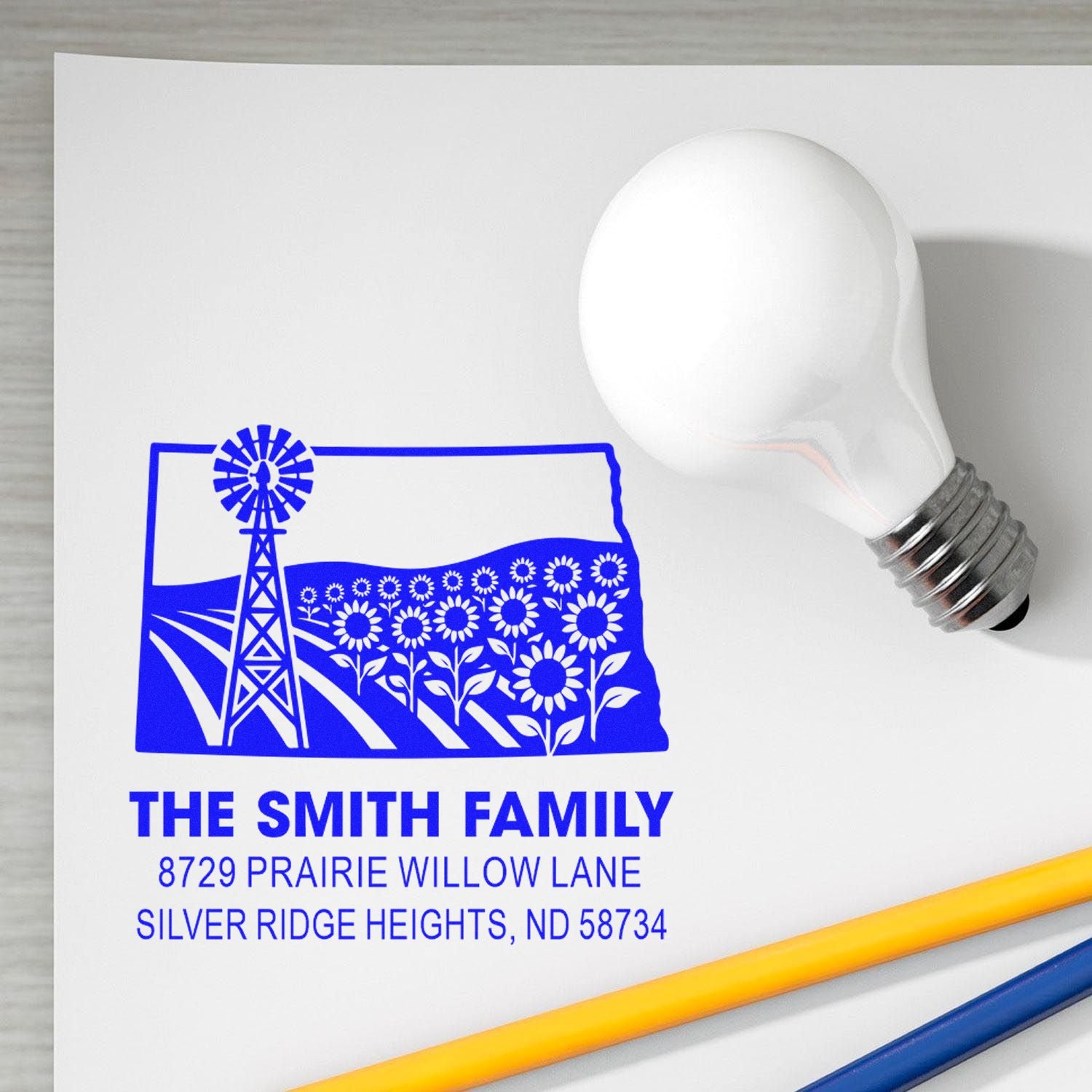 Custom rubber return address stamp with North Dakota farm windmill and flowers, personalized for The Smith Family.