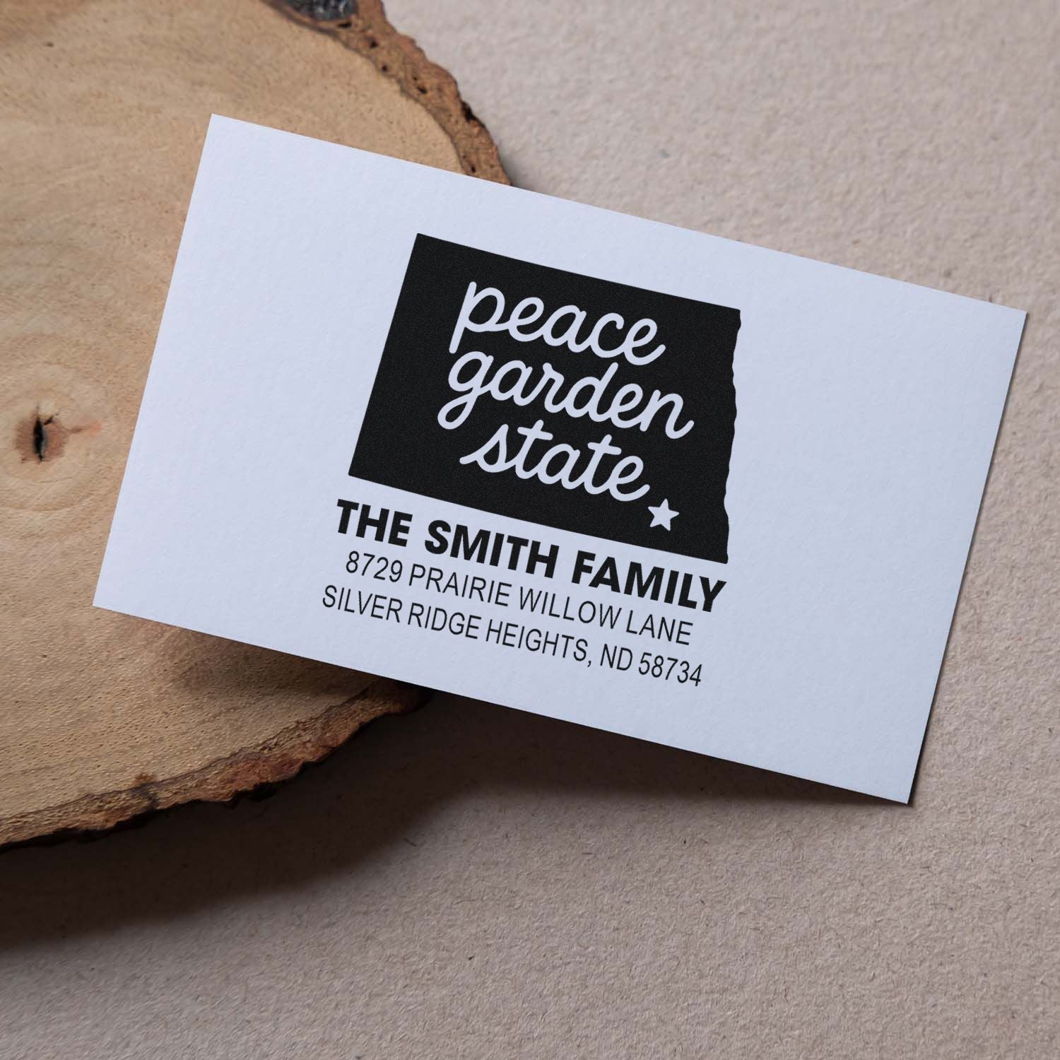 Custom return address rubber stamp for The Smith Family, featuring North Dakota Peace Garden State design.