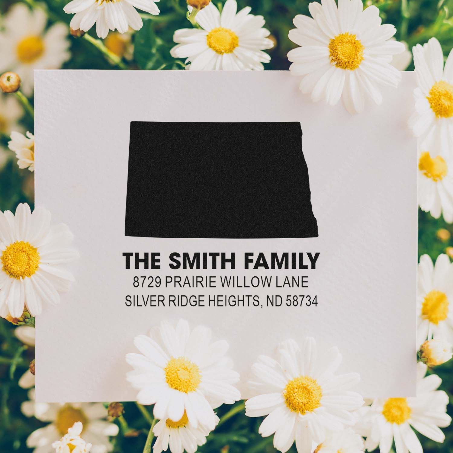 Custom family return address rubber stamp with North Dakota silhouette, The Smith Family name, and floral design.