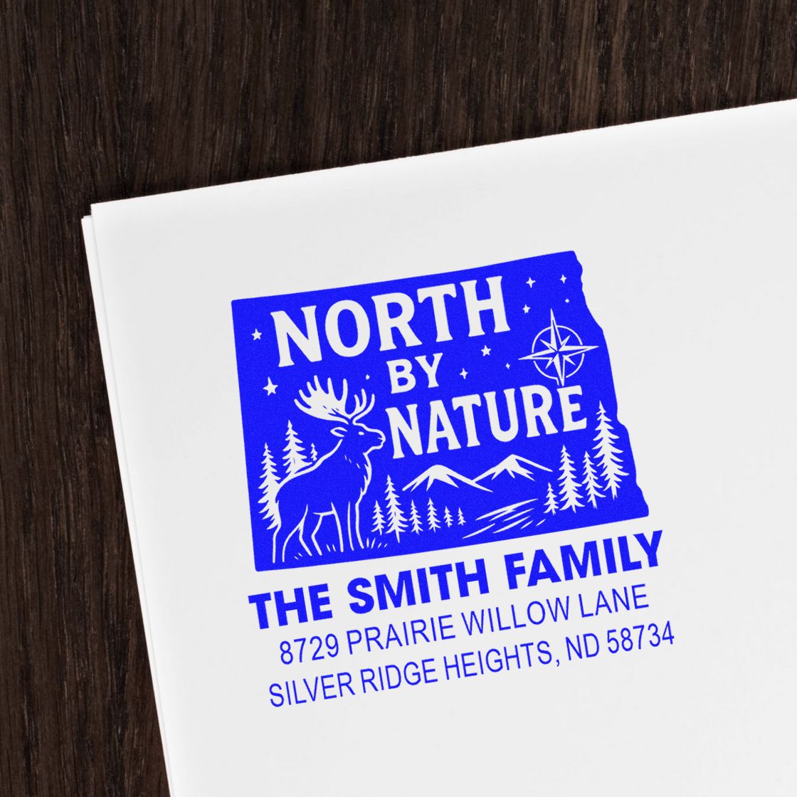 Custom rubber stamp for The Smith Family with North by Nature design and address for envelopes, stationery, and mailings.