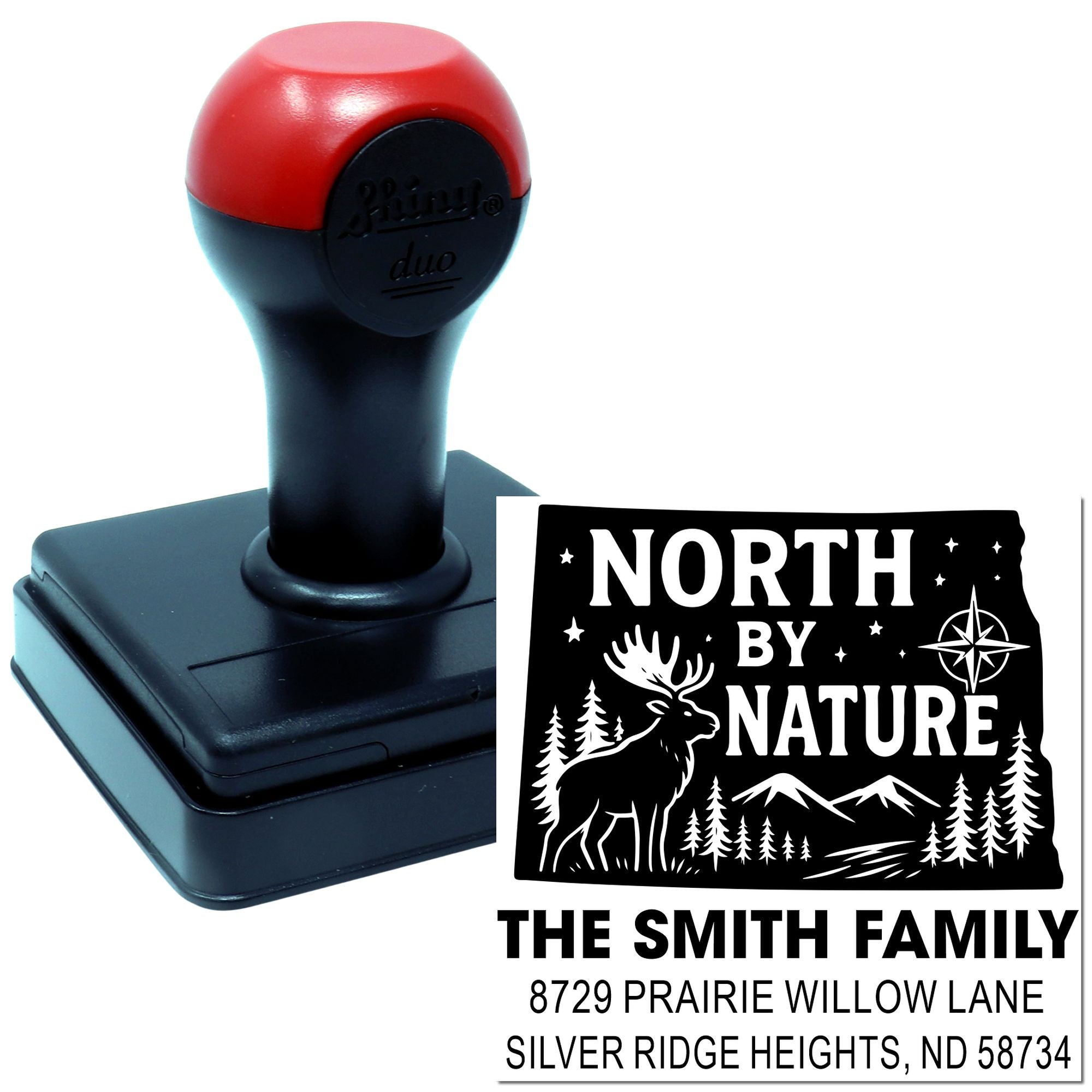 Custom self-inking rubber stamp with North by Nature return address design for personalized mailing and outdoor-themed branding.