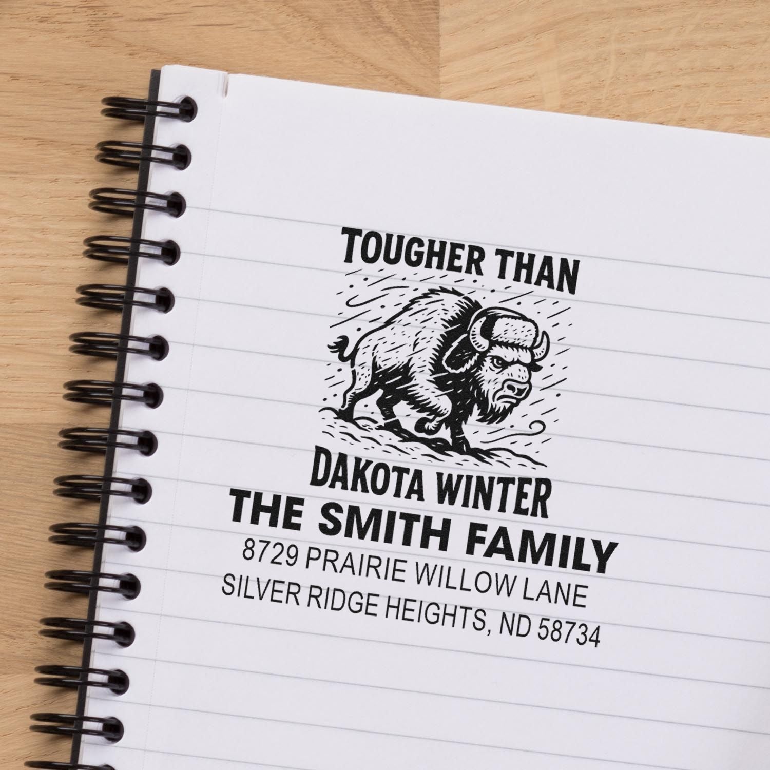 Custom buffalo address rubber stamp with family name and North Dakota address, featuring a Tougher Than Dakota Winter design.
