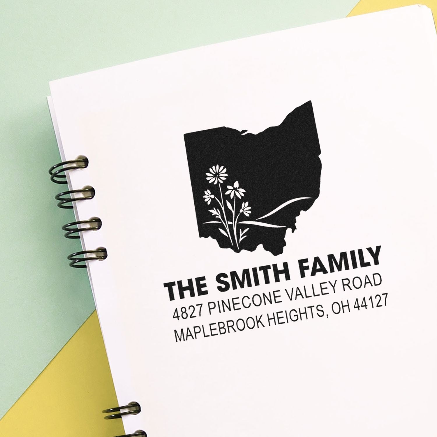 Custom Smith family address rubber stamp with Ohio silhouette and floral design for mailing envelopes.