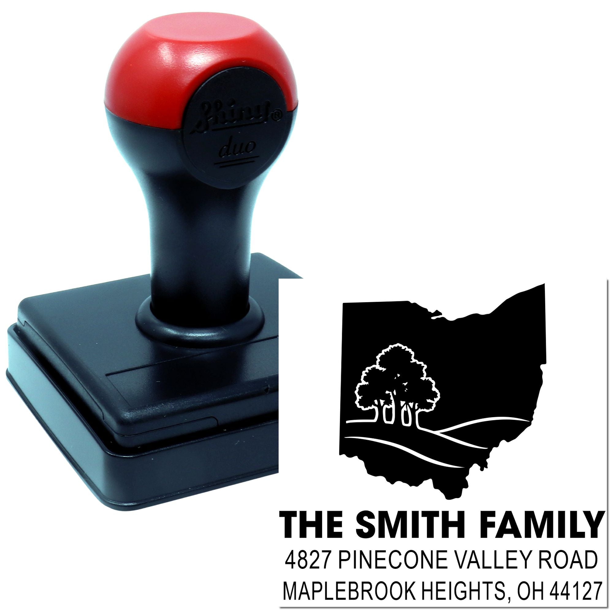 Custom self-inking address rubber stamp with Ohio family name and pine tree logo for personalized mail and return envelopes.