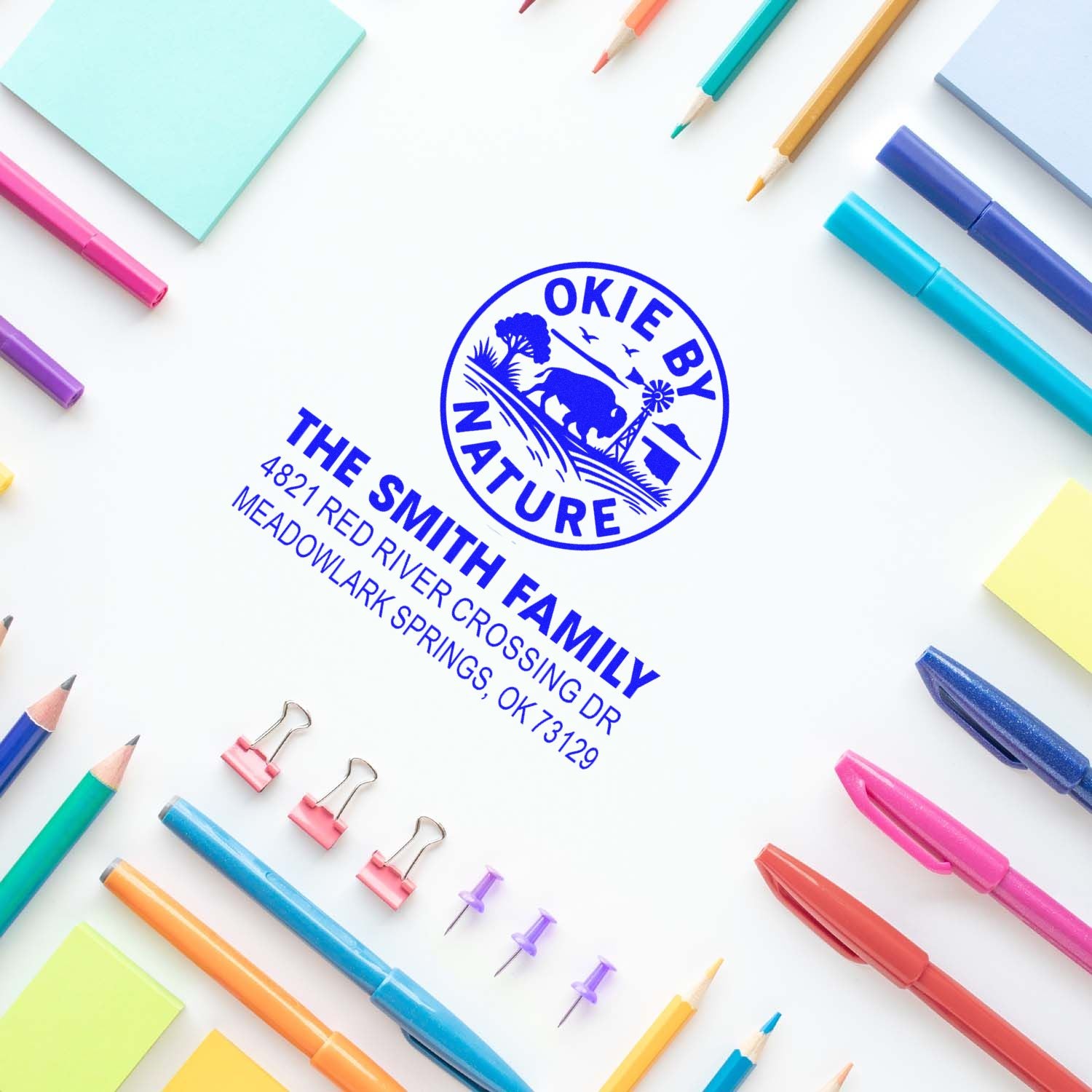 Custom rubber return address stamp for The Smith Family with Okie by Nature design, shown on white paper with stationery.