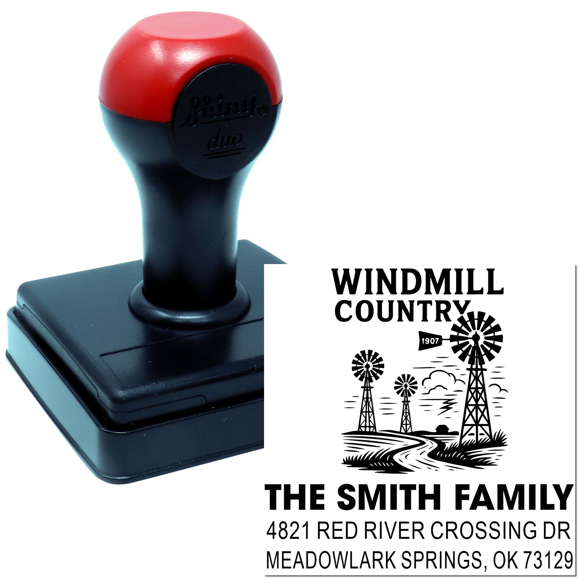 Custom self-inking rubber address stamp with windmill country family design for personalized mailing and return addresses.