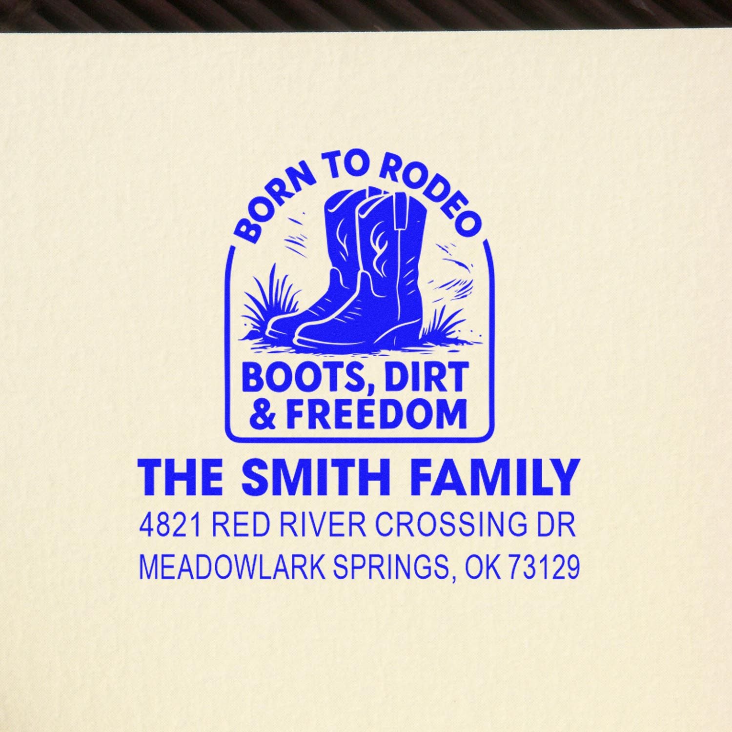 Custom blue rubber address stamp for The Smith Family with cowboy boots logo and Born to Rodeo, Boots, Dirt & Freedom slogan.