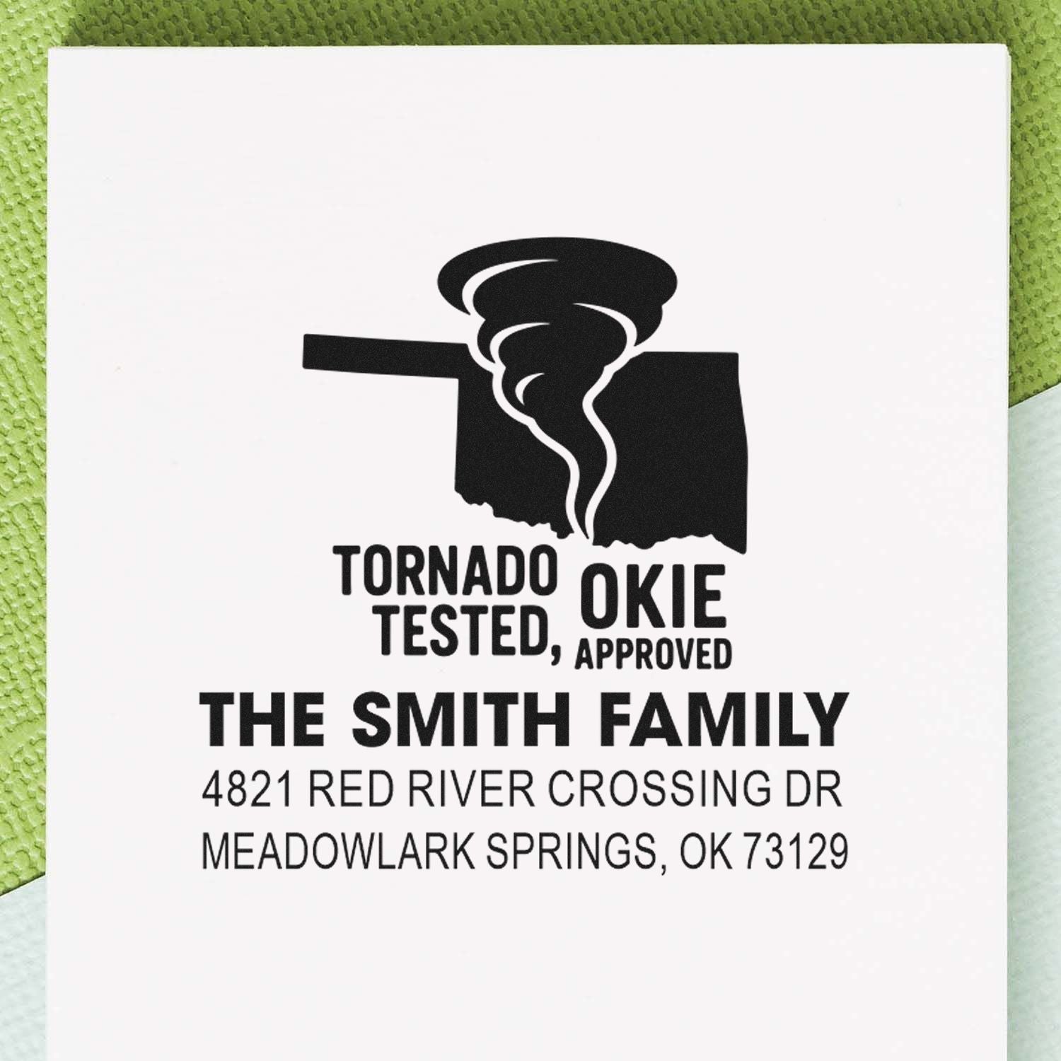 Custom rubber stamp with Oklahoma tornado icon, Tornado Tested, Okie Approved, and Smith Family address in Meadowlark Springs, OK.