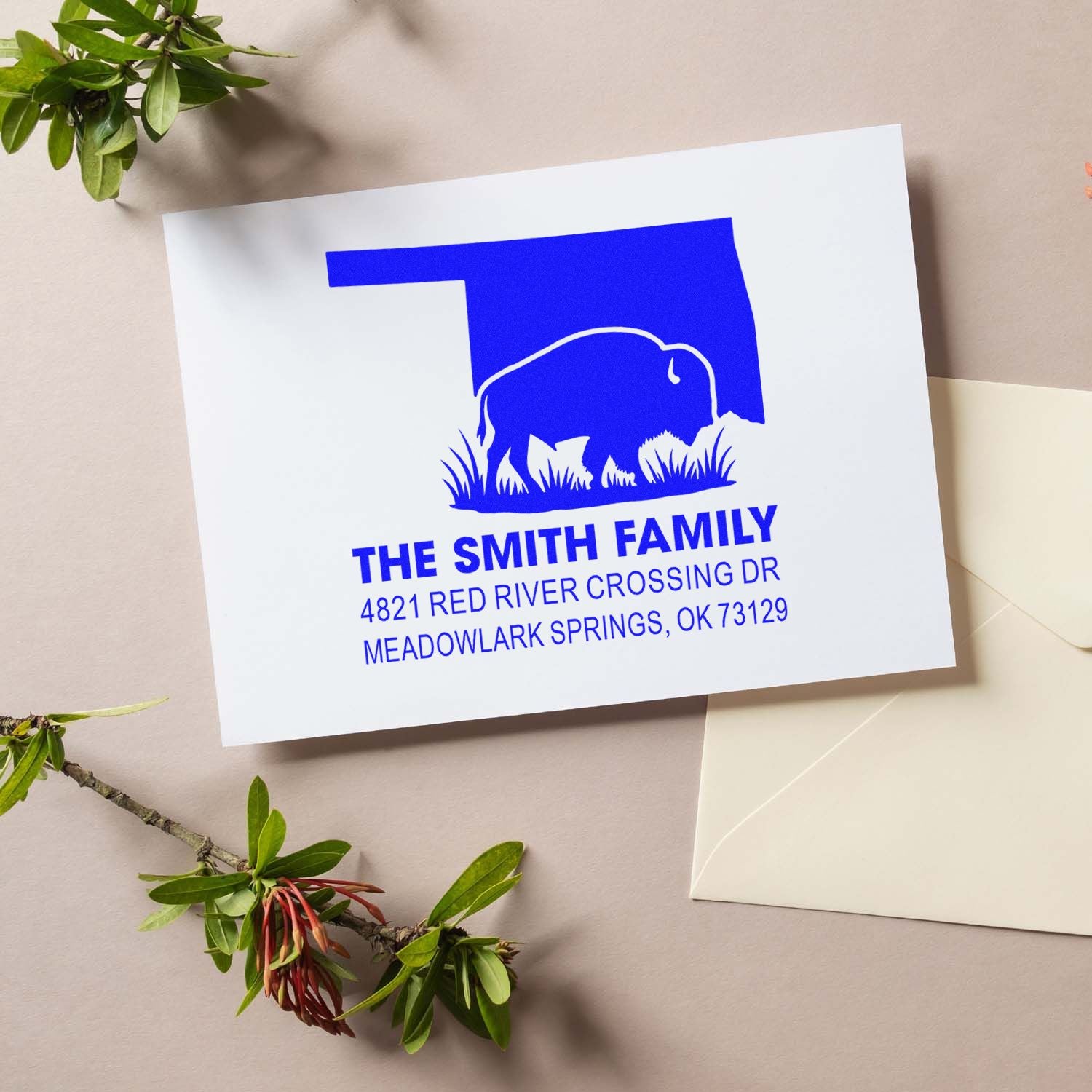 Custom bison return address rubber stamp with family name and Oklahoma mailing address on stationery.