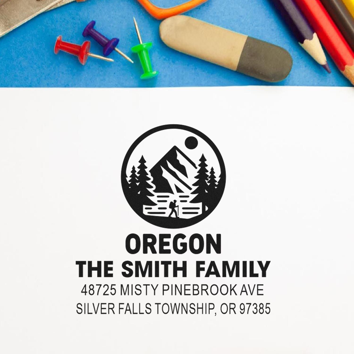Custom Oregon return address rubber stamp with mountain hiking logo and family name for personalized mailing.