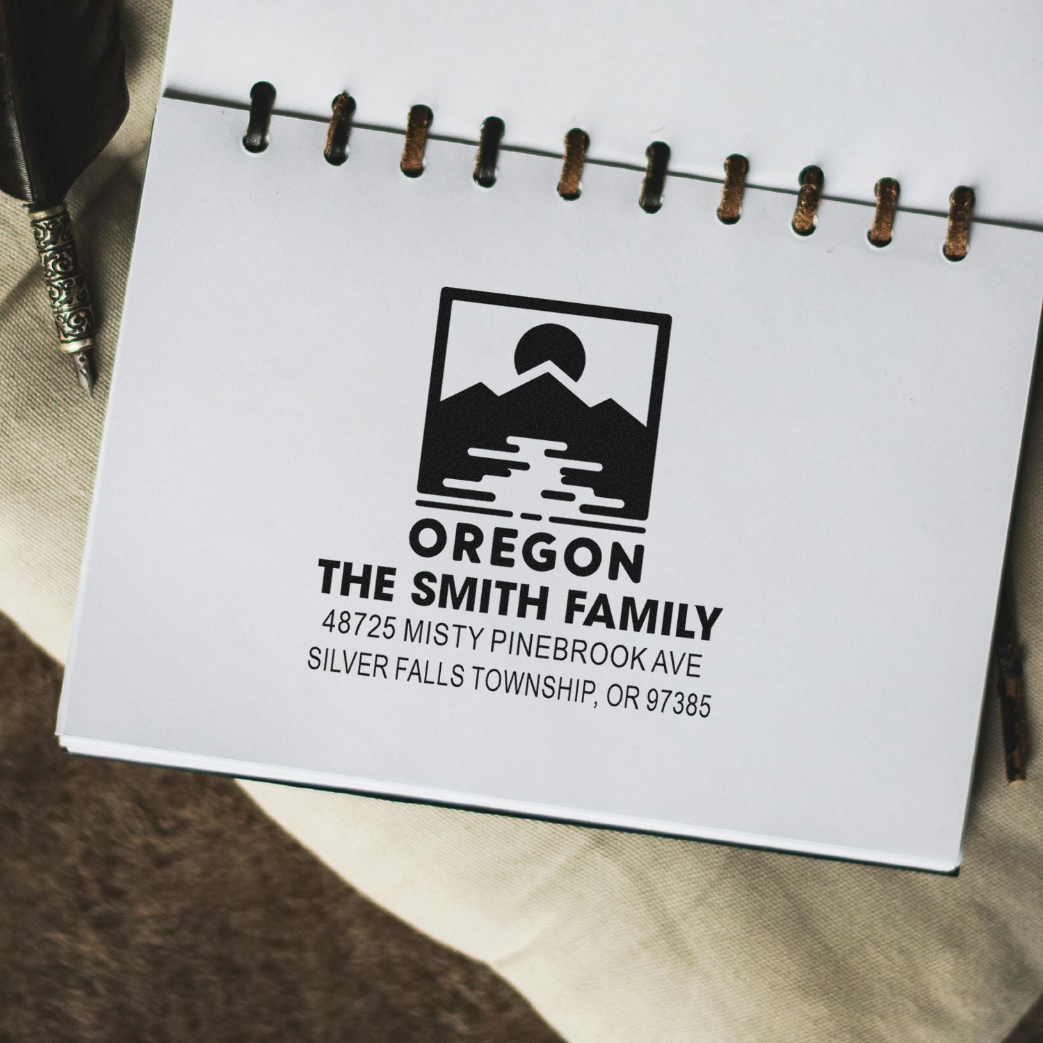 Custom rubber address stamp for The Smith Family in Oregon, featuring a mountain logo and personalized mailing details.