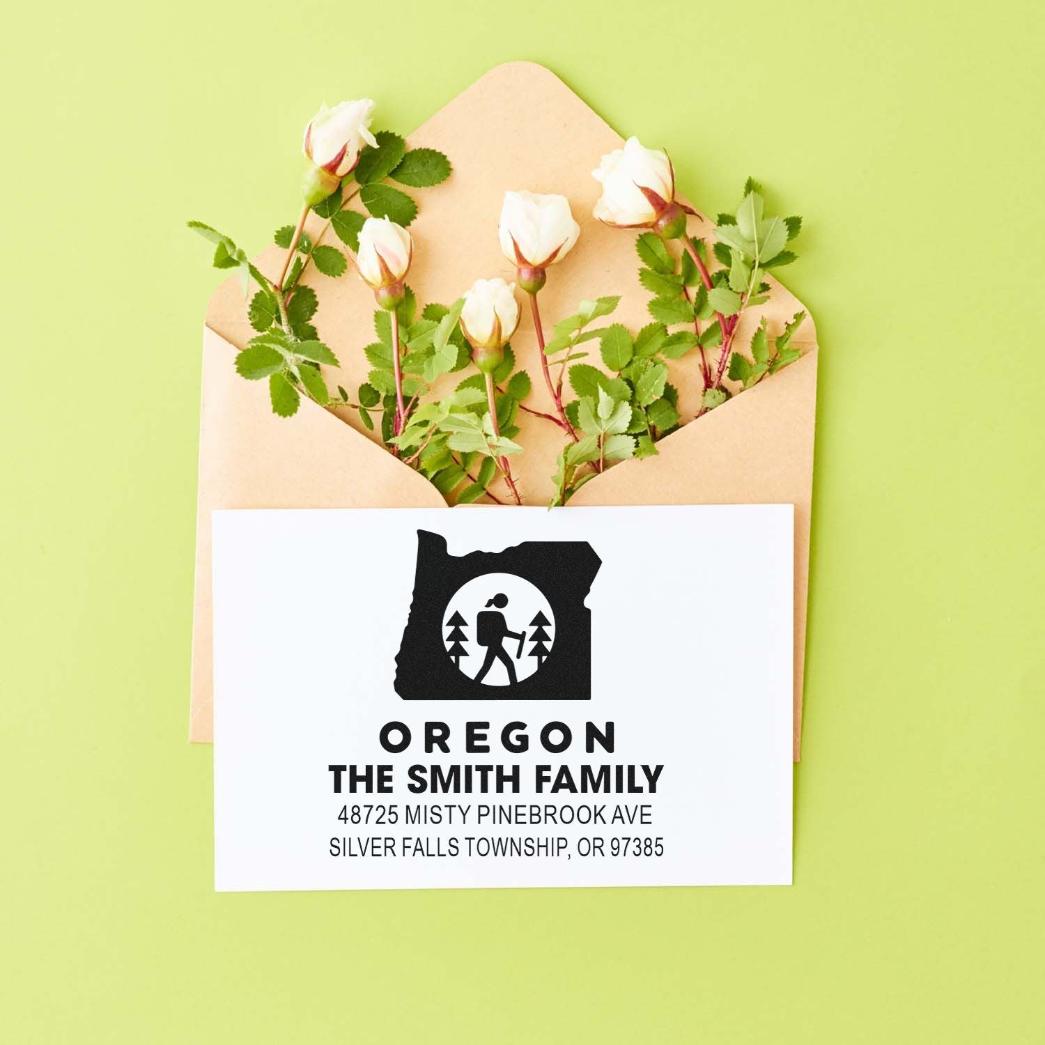 Personalized Oregon return address rubber stamp for envelopes, featuring family name and hiking logo.