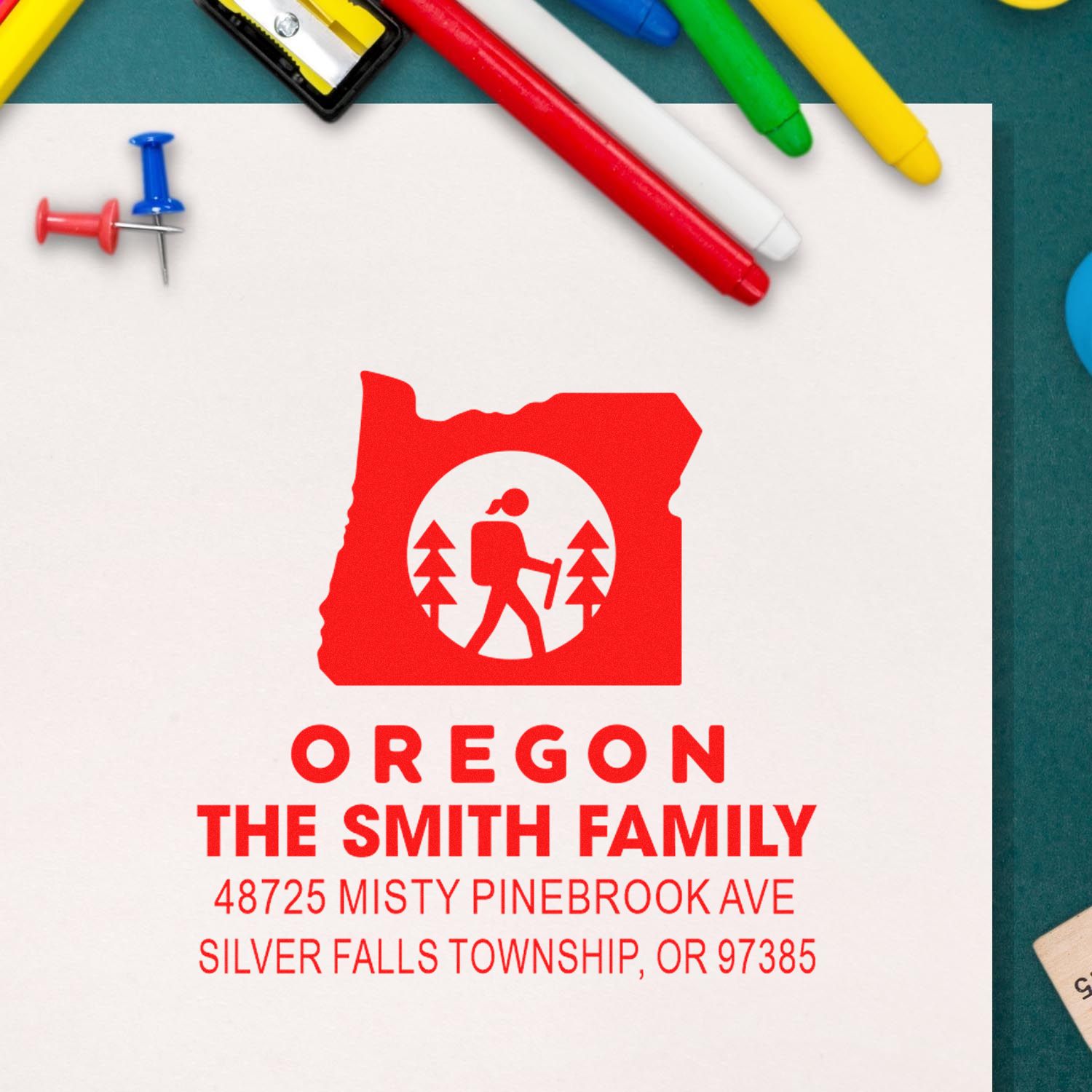 Personalized Oregon return address rubber stamp for The Smith Family, featuring hiking logo and custom address.
