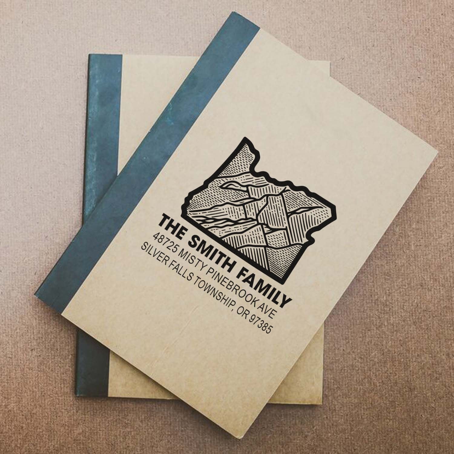 The Smith Family custom address rubber stamp on notebook cover for personalized stationery.
