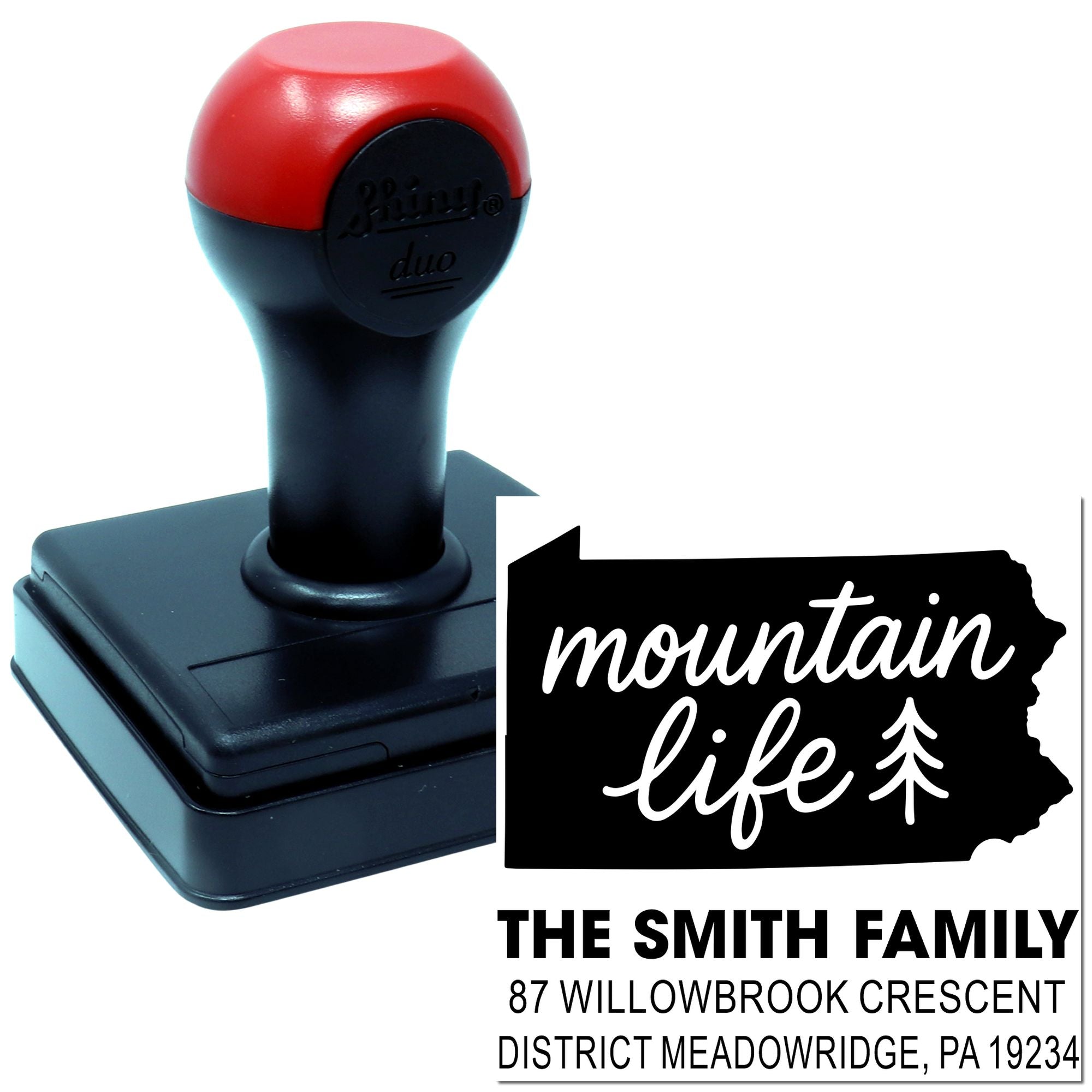 Custom self-inking rubber return address stamp with Mountain Life design and family name