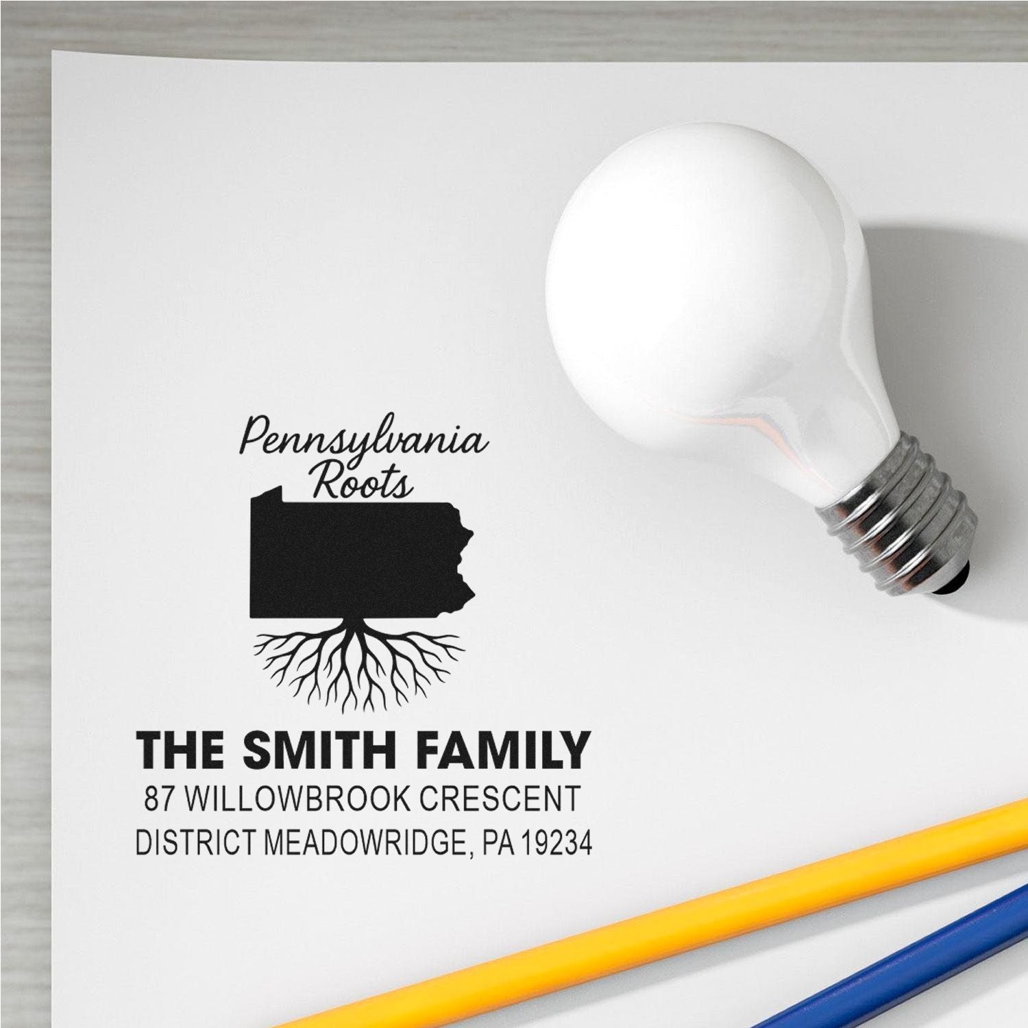 Custom Pennsylvania Roots rubber stamp with family name and address, featuring state silhouette and roots design for mailing.