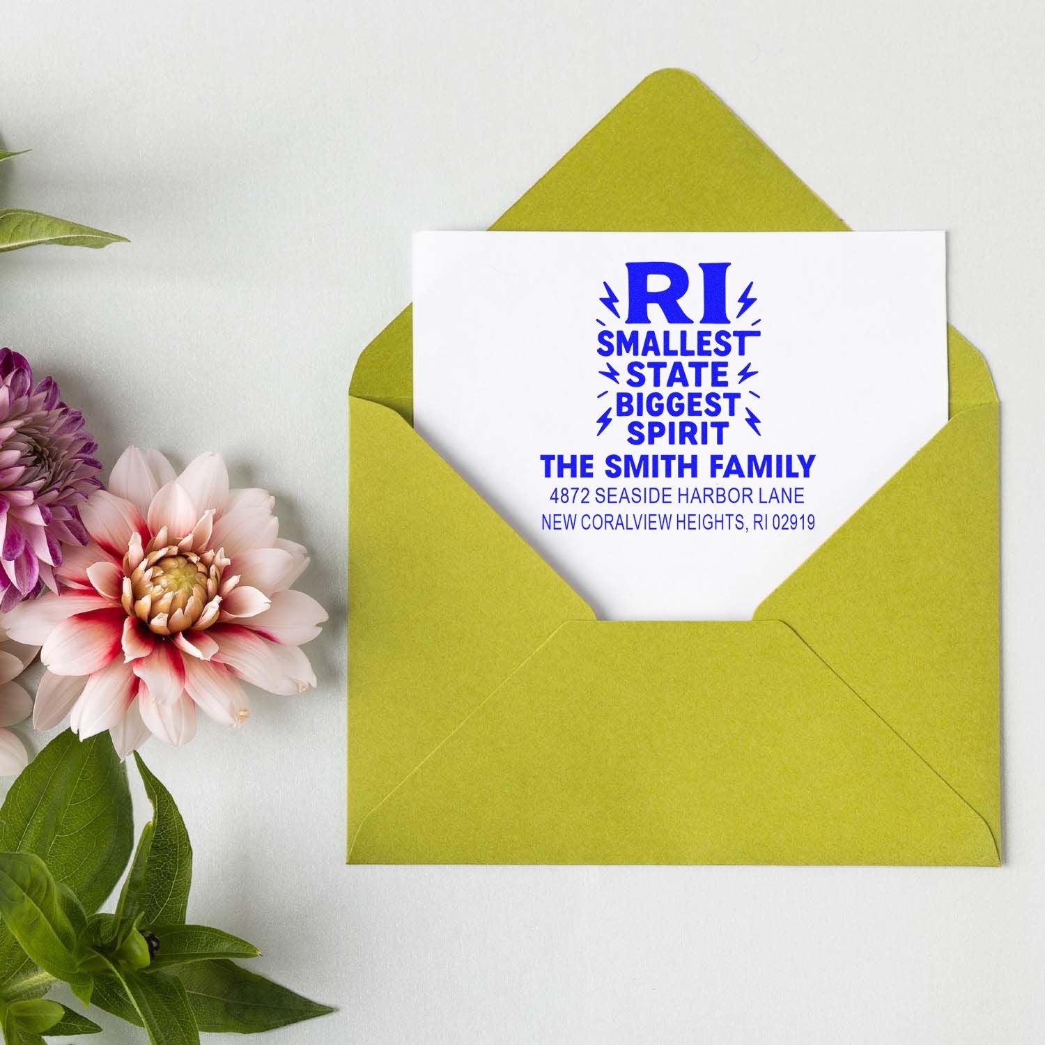 Custom return address rubber stamp on envelope for The Smith Family, featuring Rhode Island smallest state, biggest spirit design.