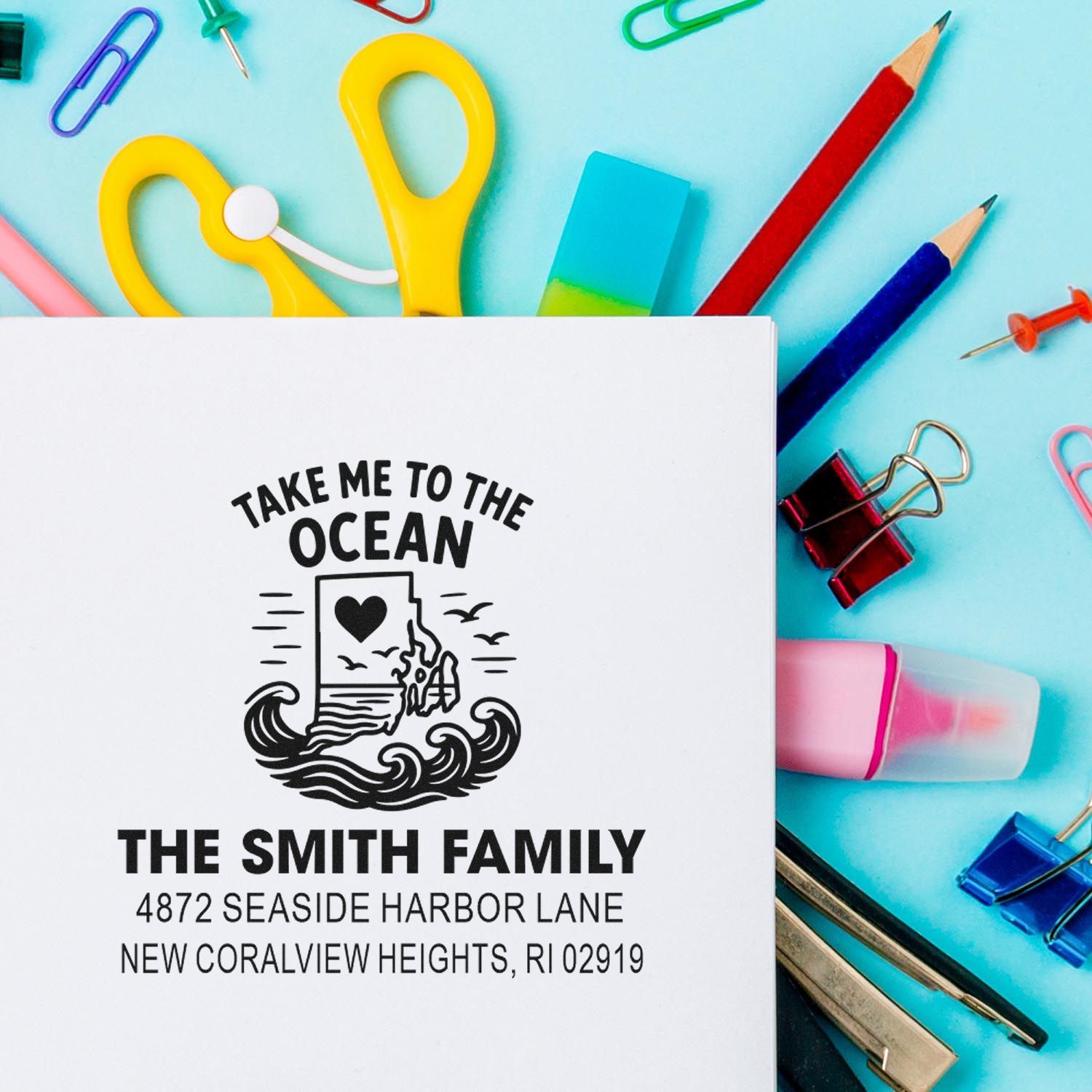 Custom ocean-themed rubber address stamp for The Smith Family with seaside return address on stationery.