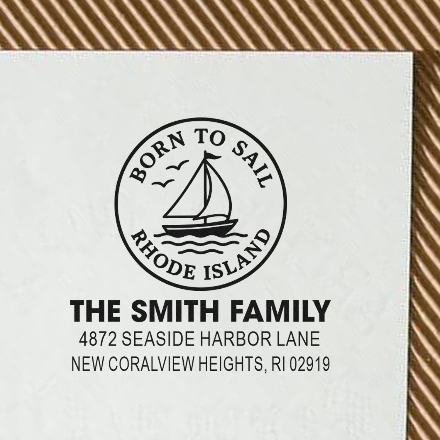 Custom nautical rubber stamp with sailboat logo, Born to Sail Rhode Island design, and personalized family address.