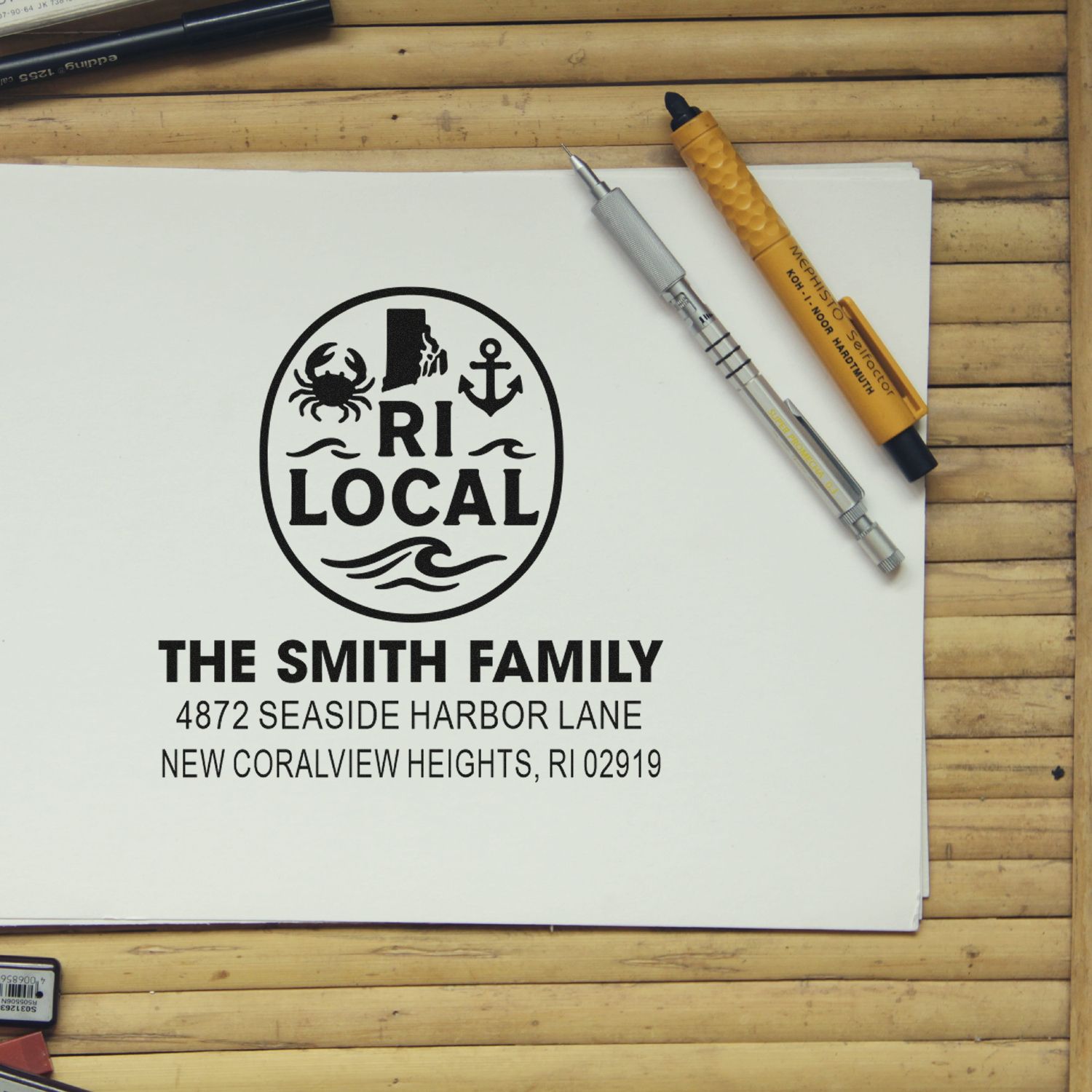 Personalized rubber address stamp for The Smith Family, featuring Rhode Island local logo and return address.