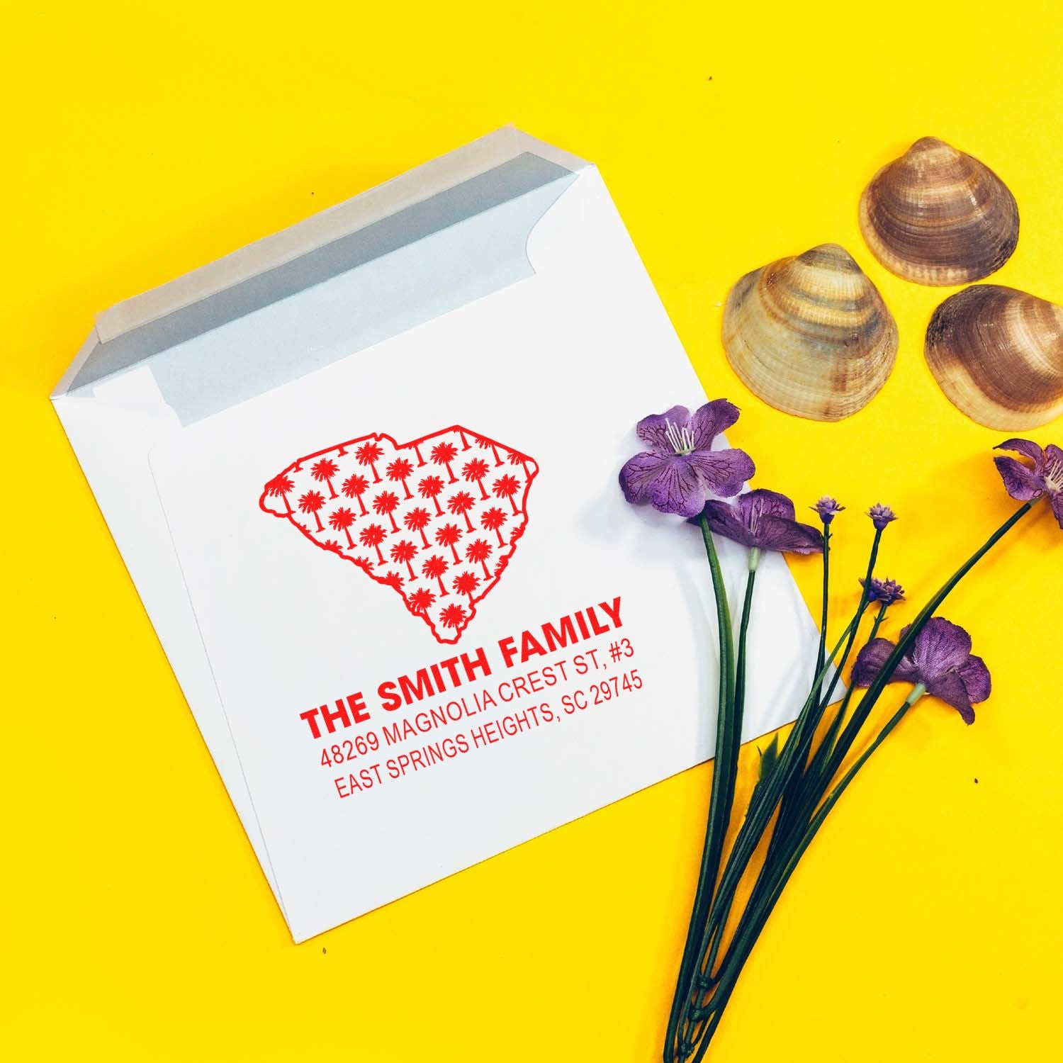 Custom return address rubber stamp on a white envelope, featuring the Smith family name and South Carolina design for personalized mail.