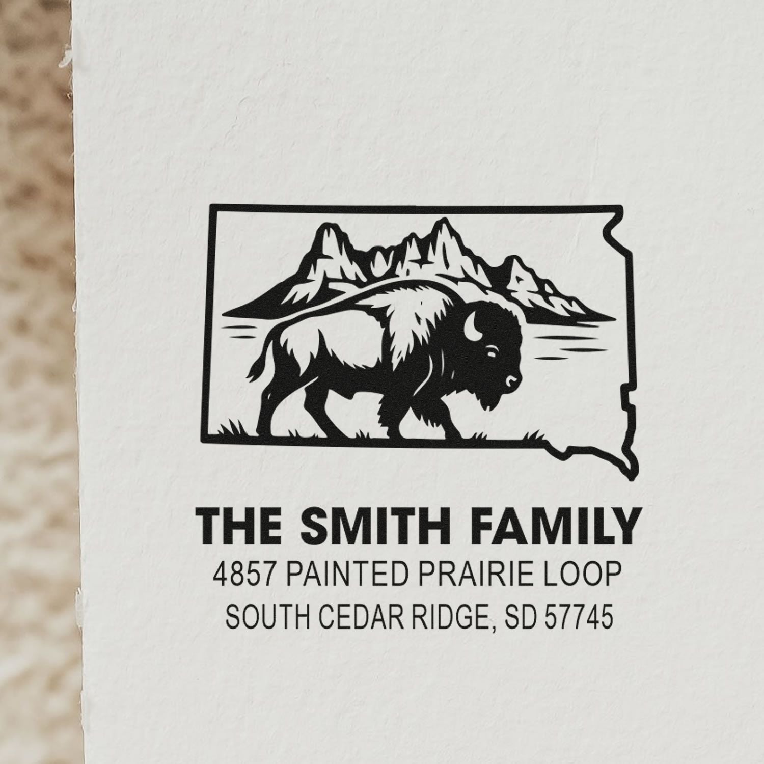 Custom rubber stamp with South Dakota outline, bison and mountains for The Smith Family address.
