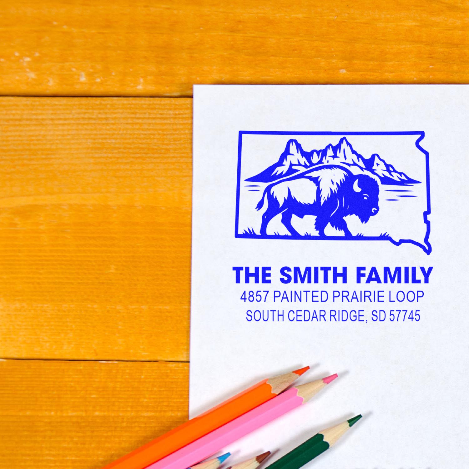 Custom return address rubber stamp featuring a buffalo South Dakota design for The Smith Family home address.