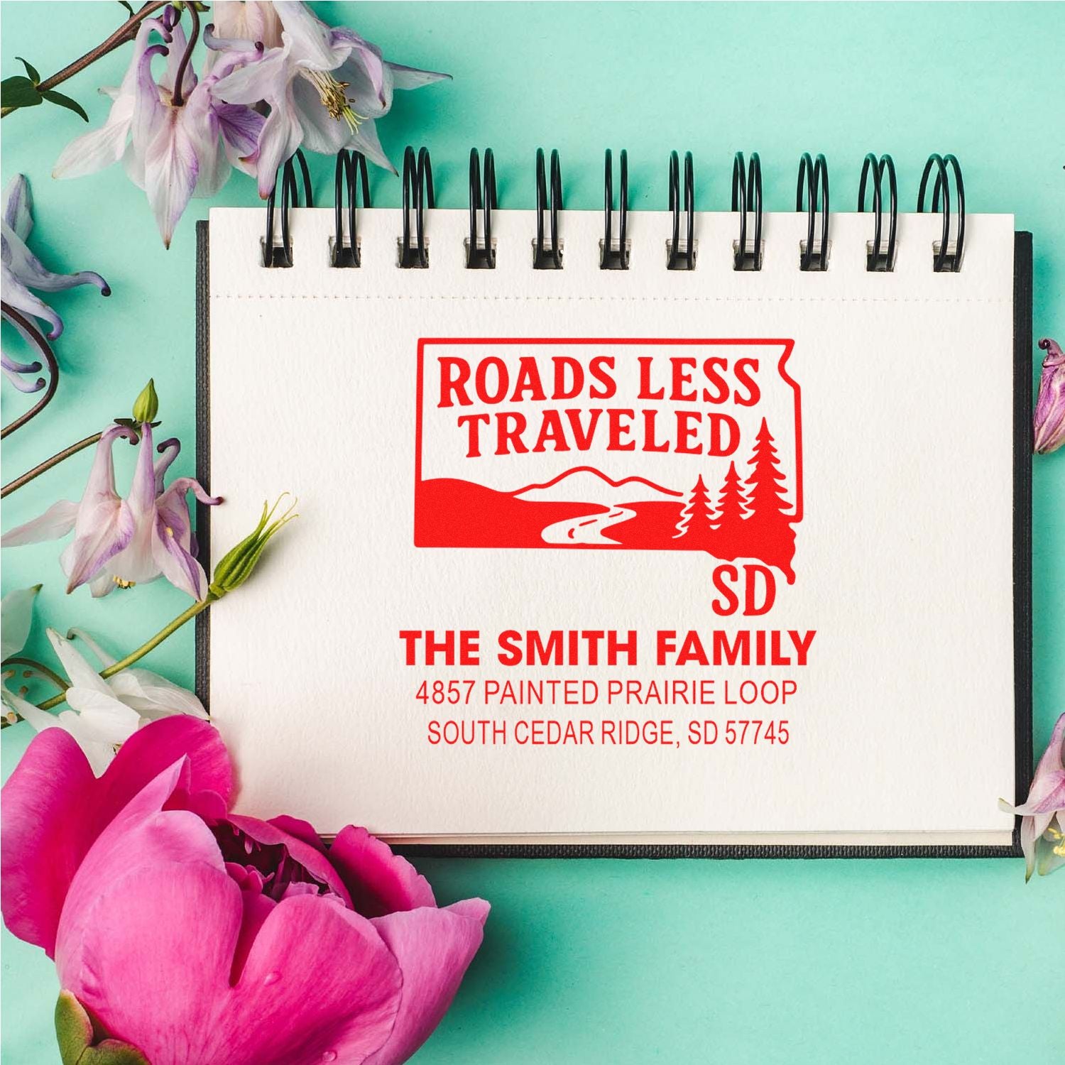 Custom return address rubber stamp with Roads Less Traveled design for The Smith Family in South Cedar Ridge, SD.