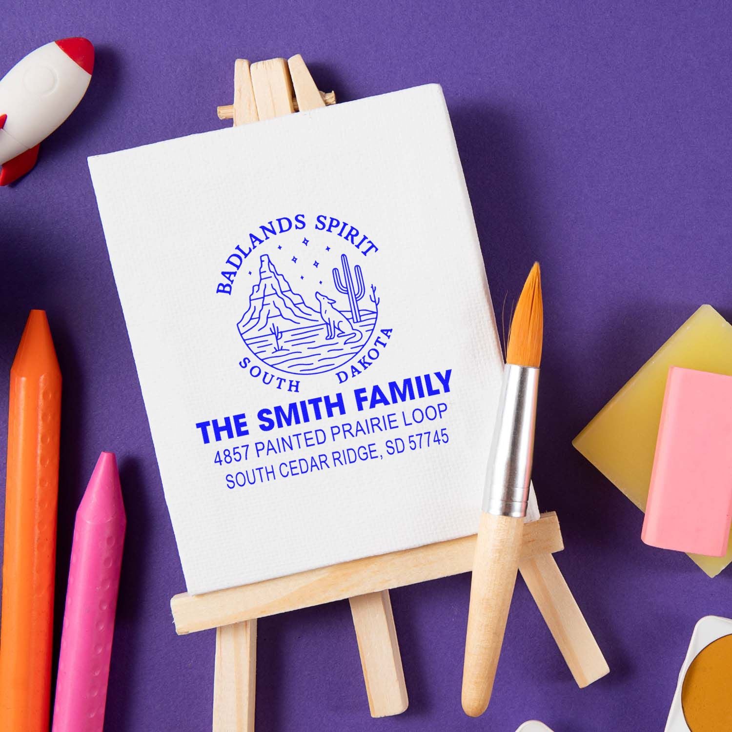 Custom family return address rubber stamp on canvas easel with Badlands South Dakota design, ideal for personalized stationery.