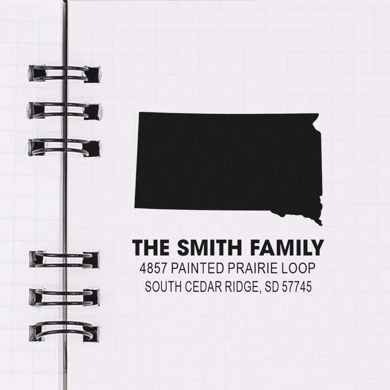 Custom rubber address stamp for The Smith Family with South Dakota state silhouette and mailing address.
