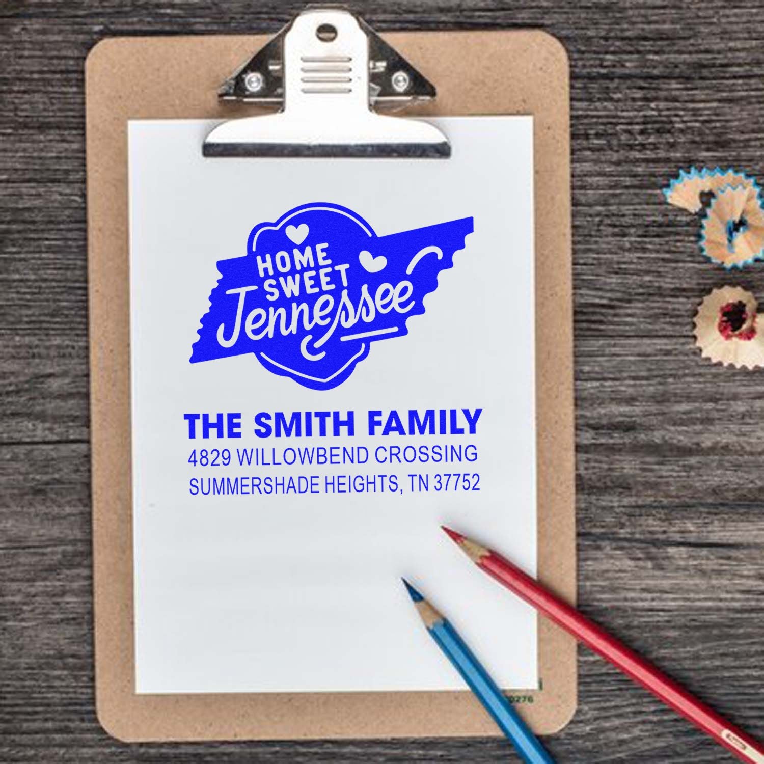 Custom Home Sweet Tennessee return address rubber stamp for The Smith Family on clipboard.