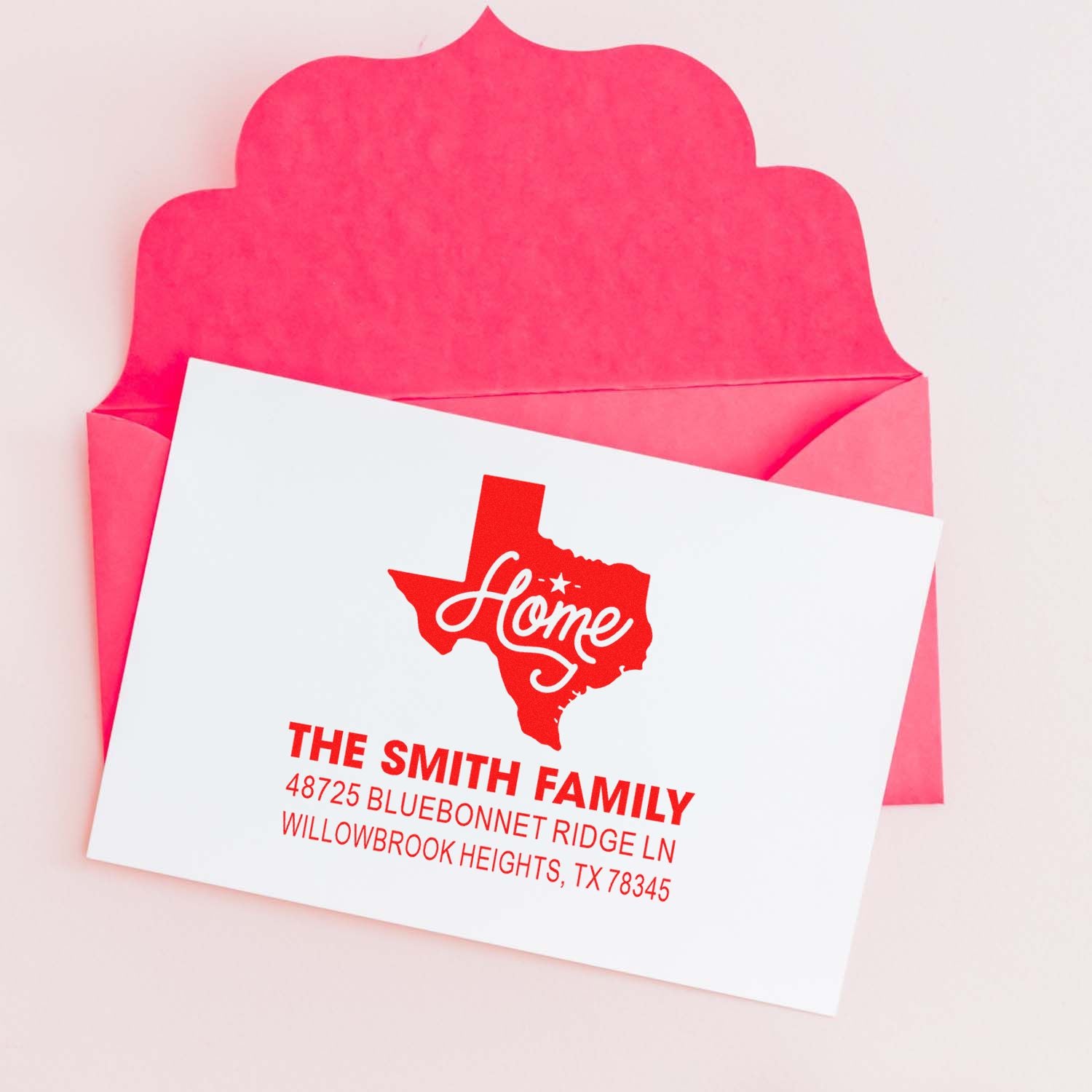 Custom Texas home return address rubber stamp on pink envelope for personalized family stationery and mailings.