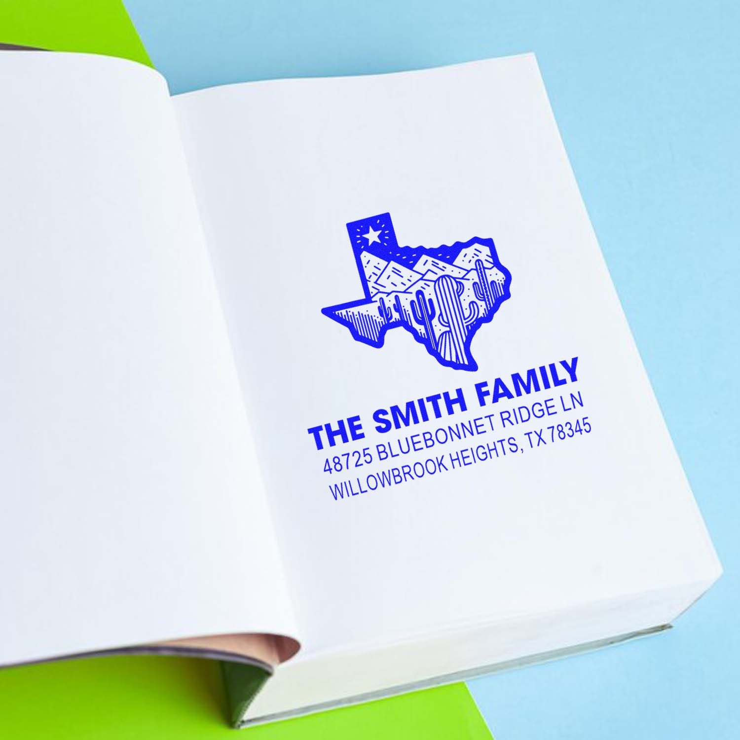 Custom Texas return address rubber stamp imprint for The Smith Family with address on a notebook page