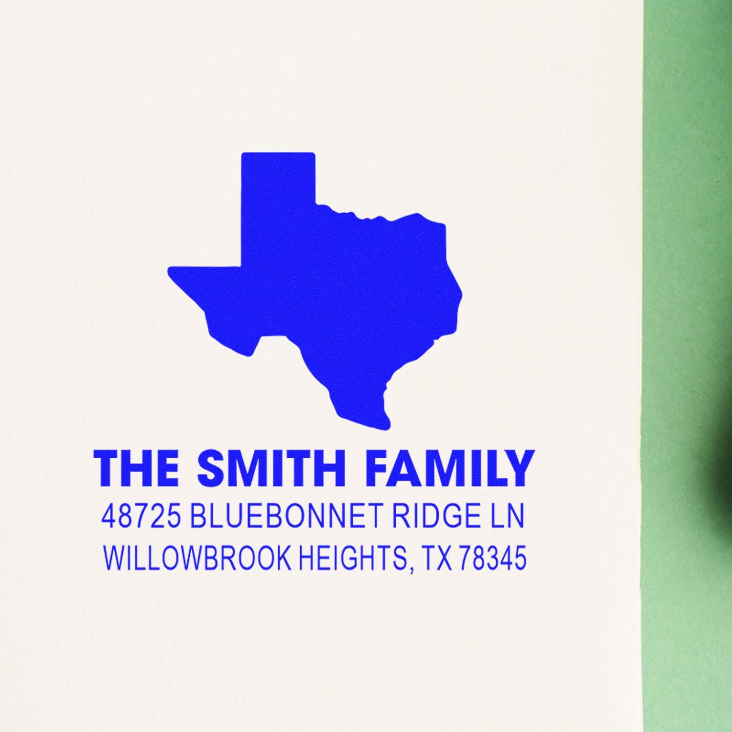 Custom Texas return address rubber stamp for The Smith Family with blue state silhouette and home address.