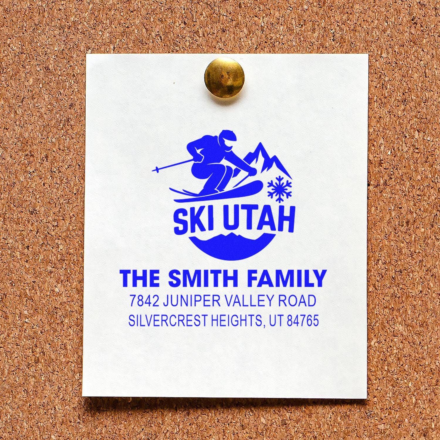 Custom ski rubber stamp design for The Smith Family, with skier logo and return address, displayed on a pinned sample card.