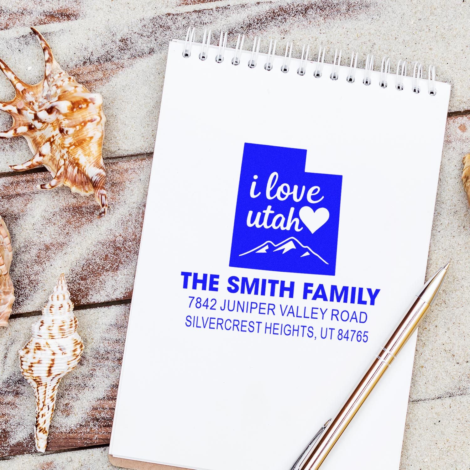 Custom Utah return address rubber stamp on spiral notebook, featuring I love Utah design for personalized family mail.