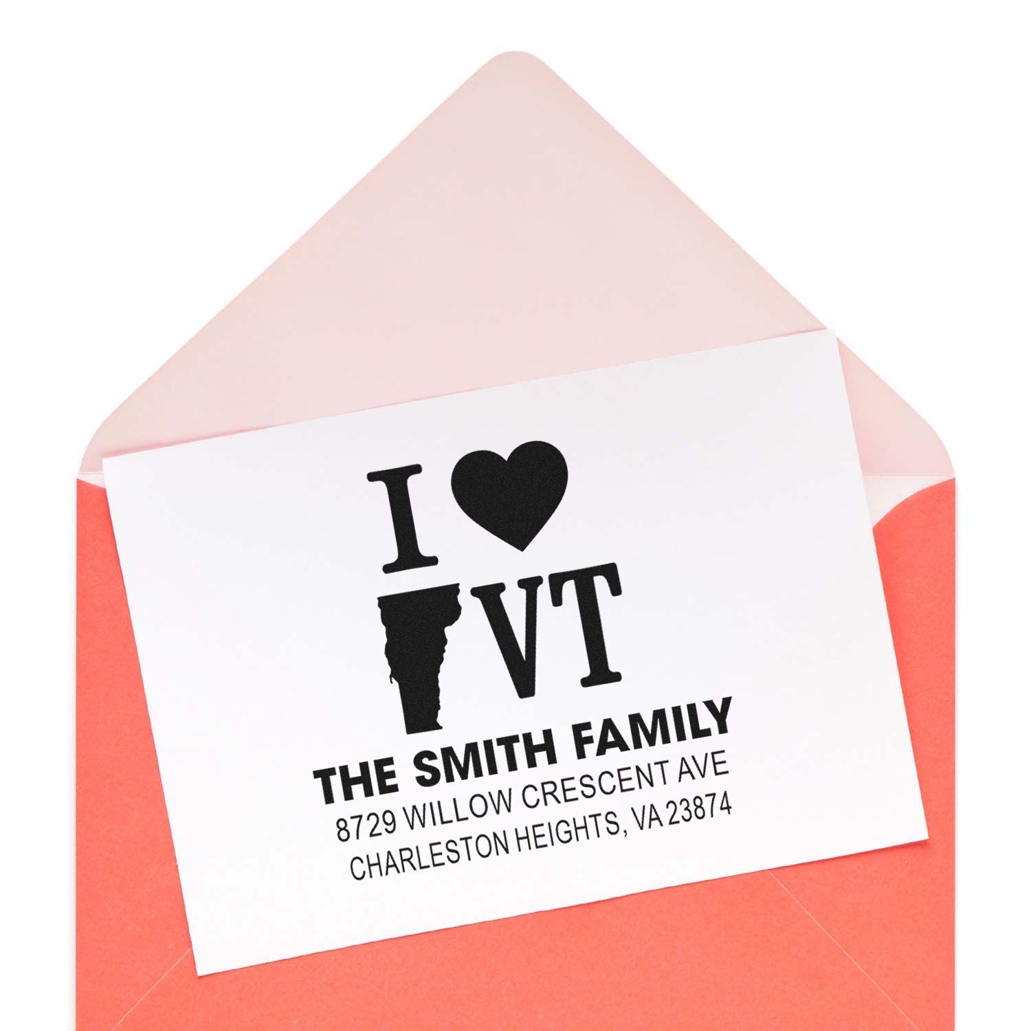 Custom return address rubber stamp on envelope, I ? VT design with family name and mailing address.
