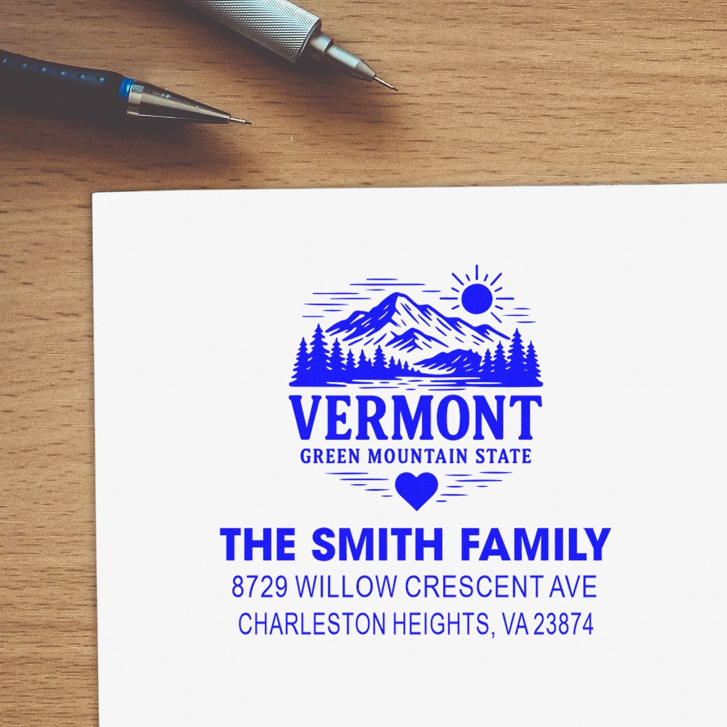 Personalized return address rubber stamp for The Smith Family with Vermont mountain logo and Charleston Heights, VA.
