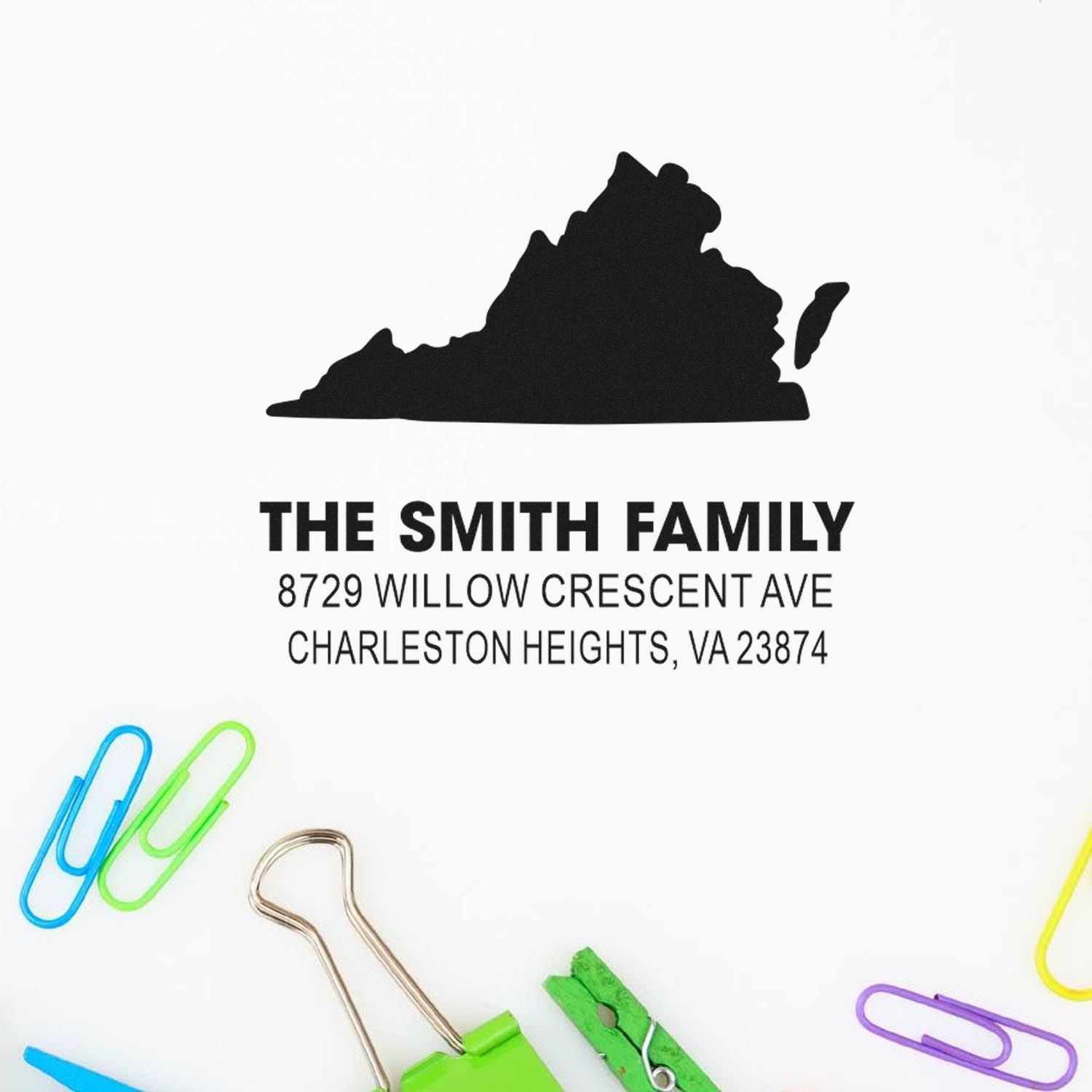Custom family address stamp with Virginia silhouette, The Smith Family, and Charleston Heights, VA address on white background with colorful paper clips.