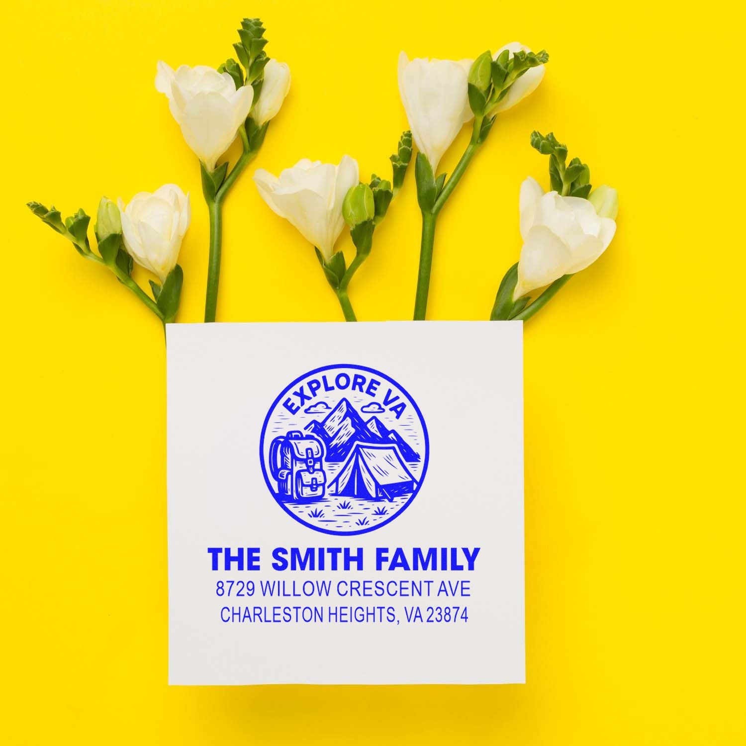 Custom family address stamp with Explore VA camping design, surrounded by white flowers on a bright yellow background.