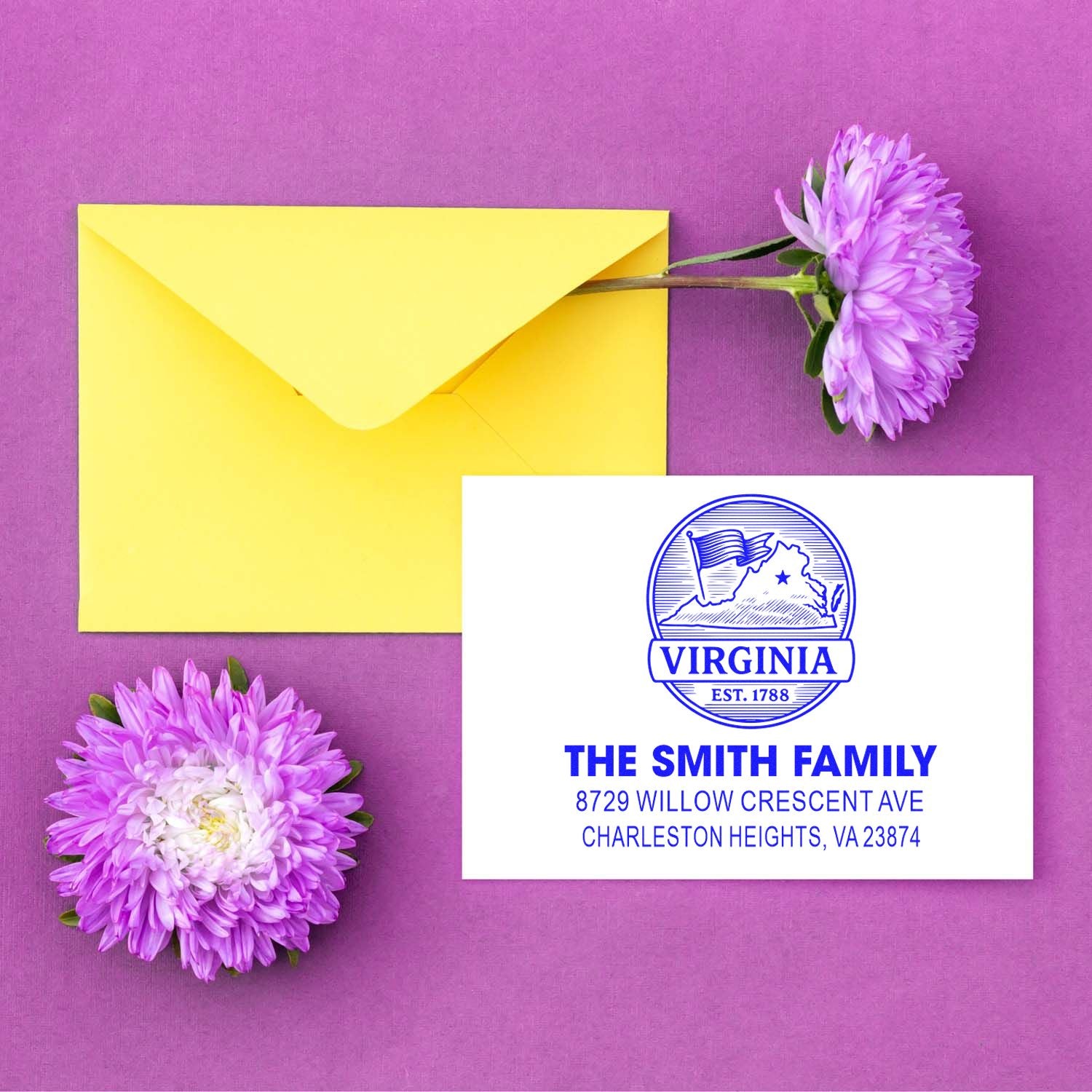 Custom Virginia return address stamp beside a yellow envelope on a purple background, accented with purple flowers and The Smith Family mailing address.