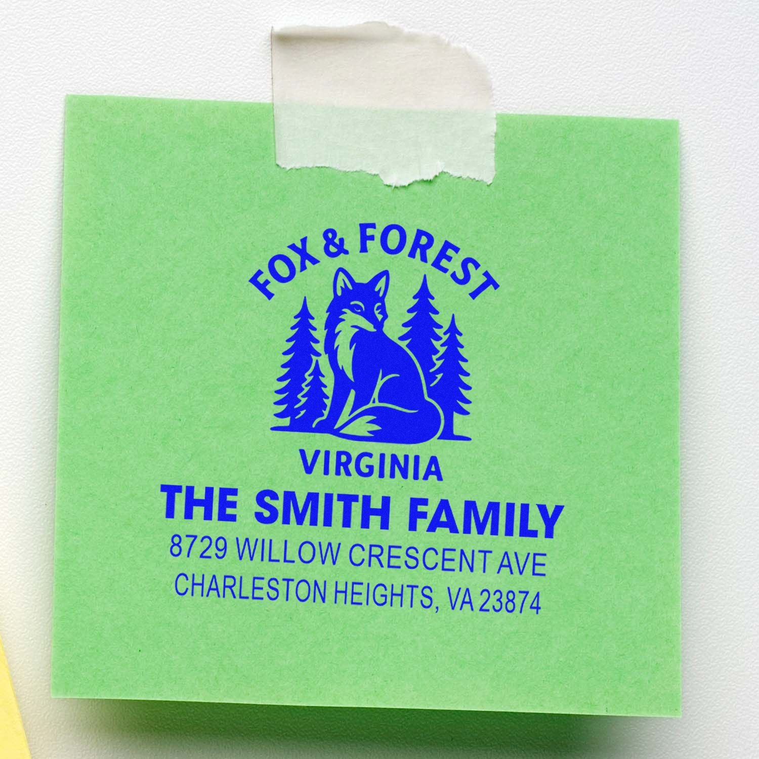 Custom fox and forest address stamp for The Smith Family, Virginia, printed on green paper with blue logo and home address.