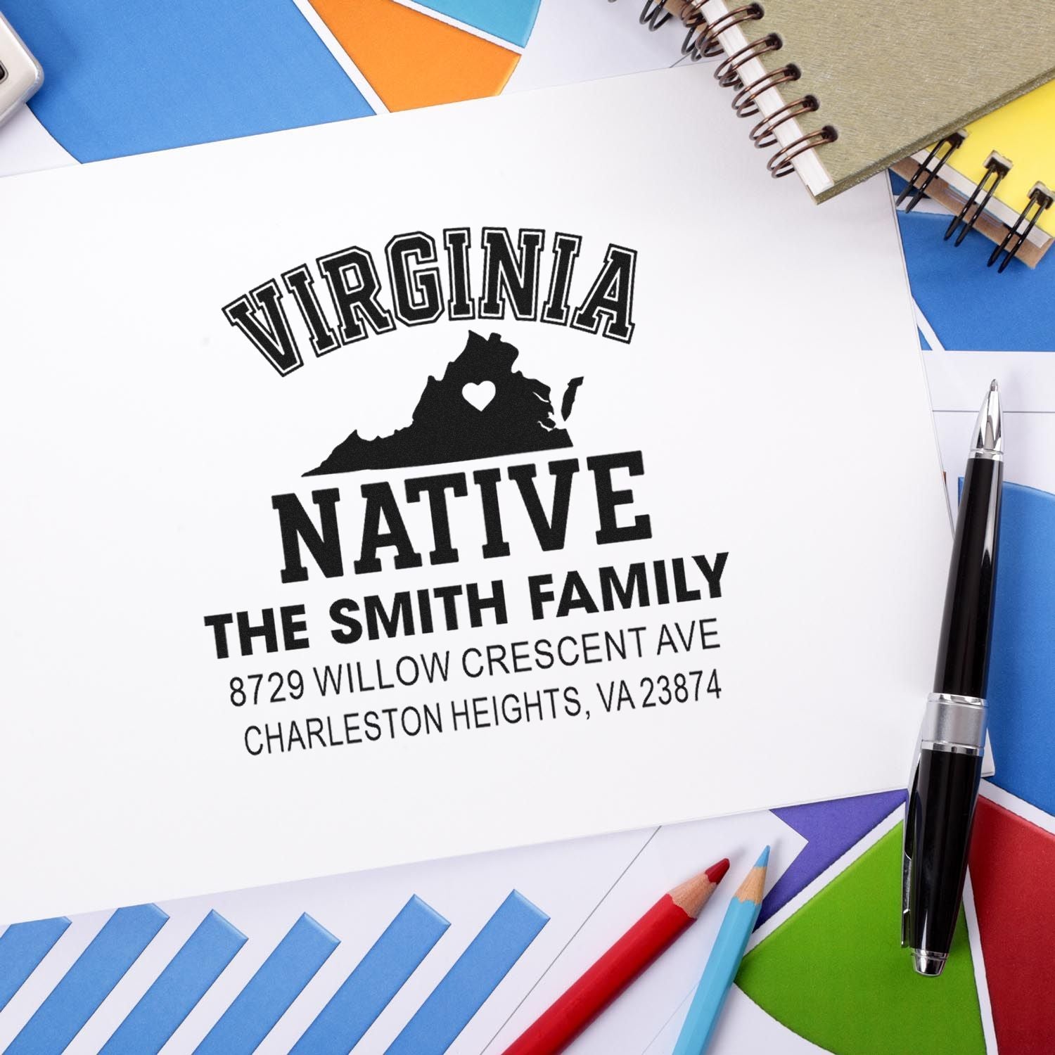 Custom Virginia Native self-inking address stamp for The Smith Family, displayed on stationery with pens, notebooks, and colorful envelopes.