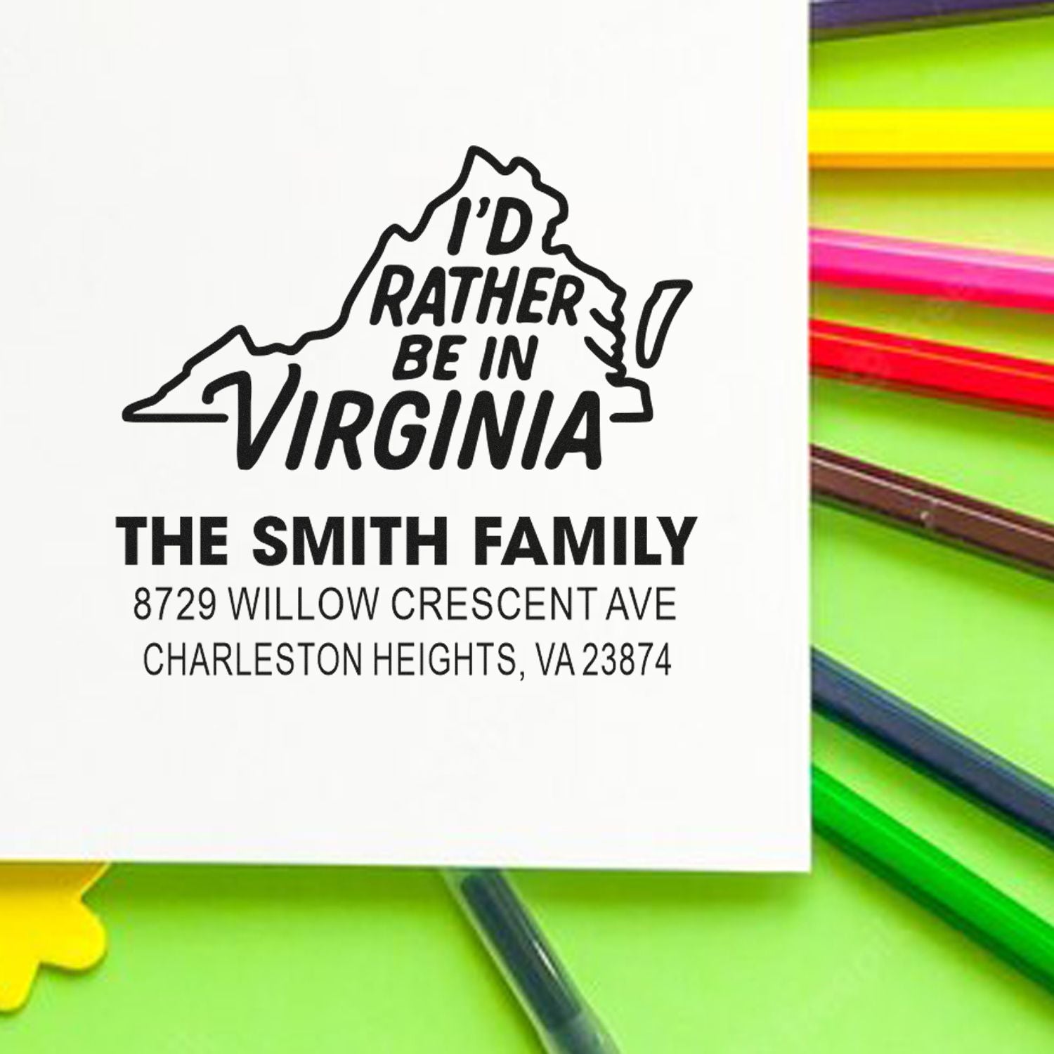 Custom Virginia state stamp reading Id Rather Be in Virginia with The Smith Family address on a white card beside colorful pens.