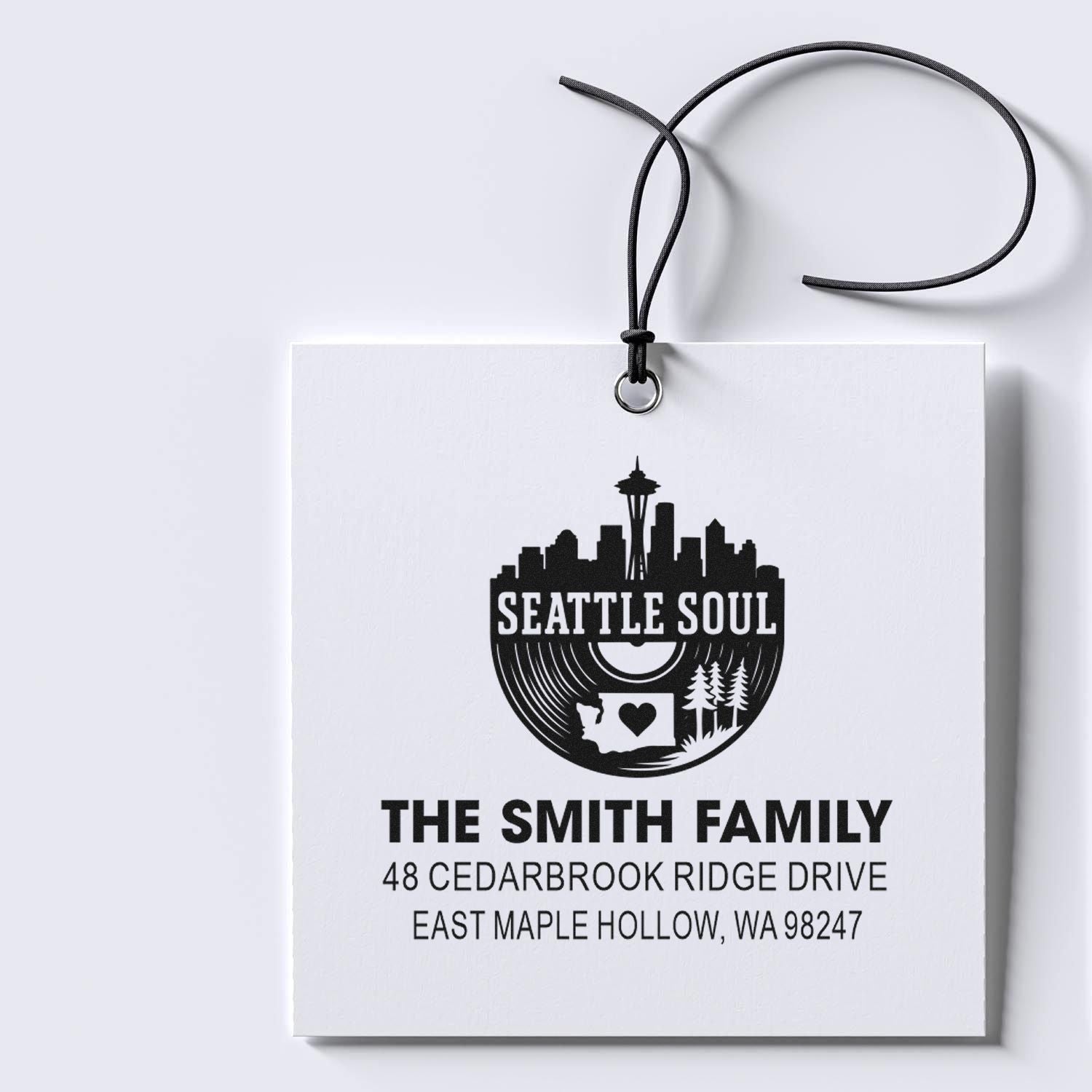 Personalized Seattle Soul address stamp on white hanging card, featuring skyline, Space Needle, The Smith Family, and WA address.