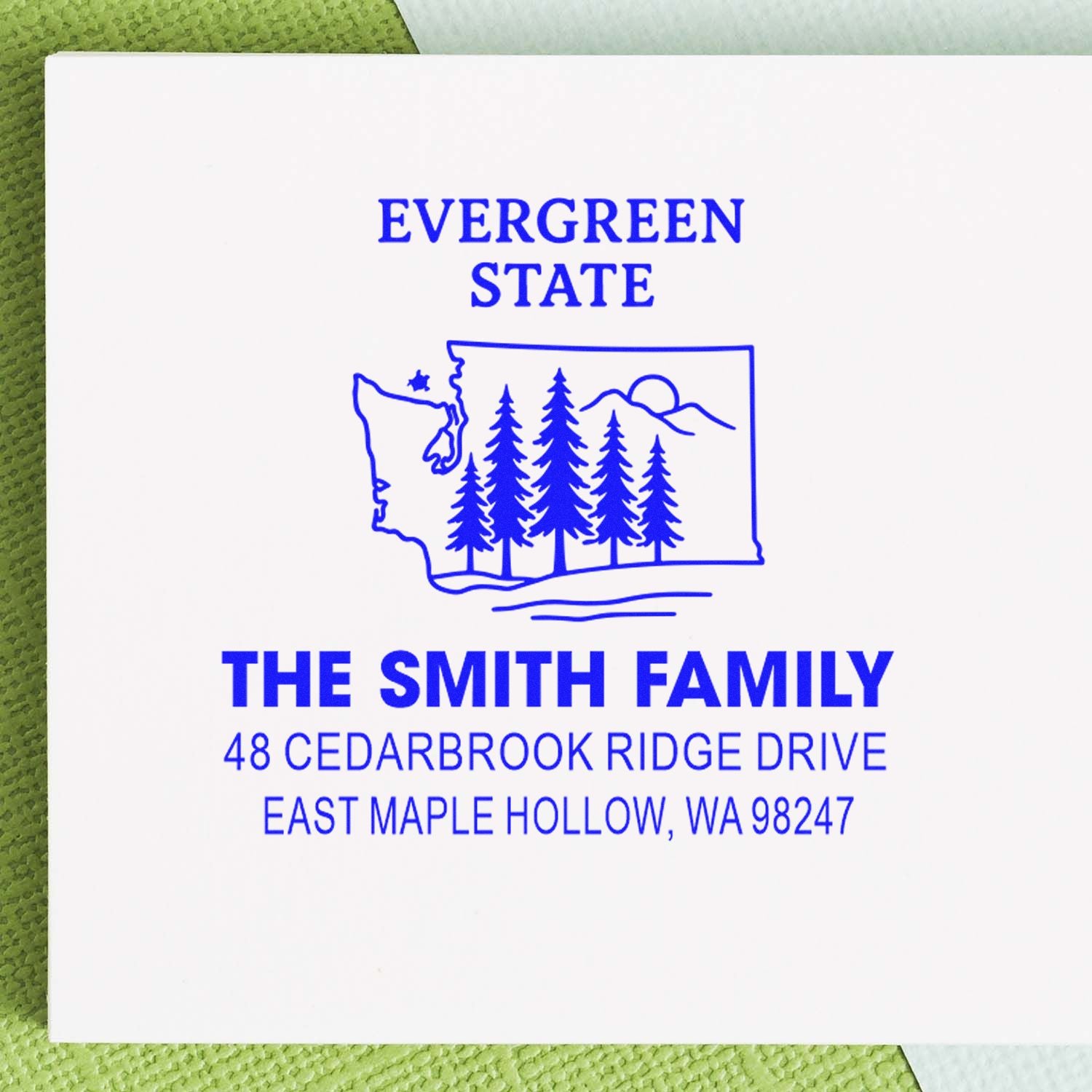 Custom return address stamp for The Smith Family, featuring Evergreen State, Washington outline, pine trees, and East Maple Hollow, WA.